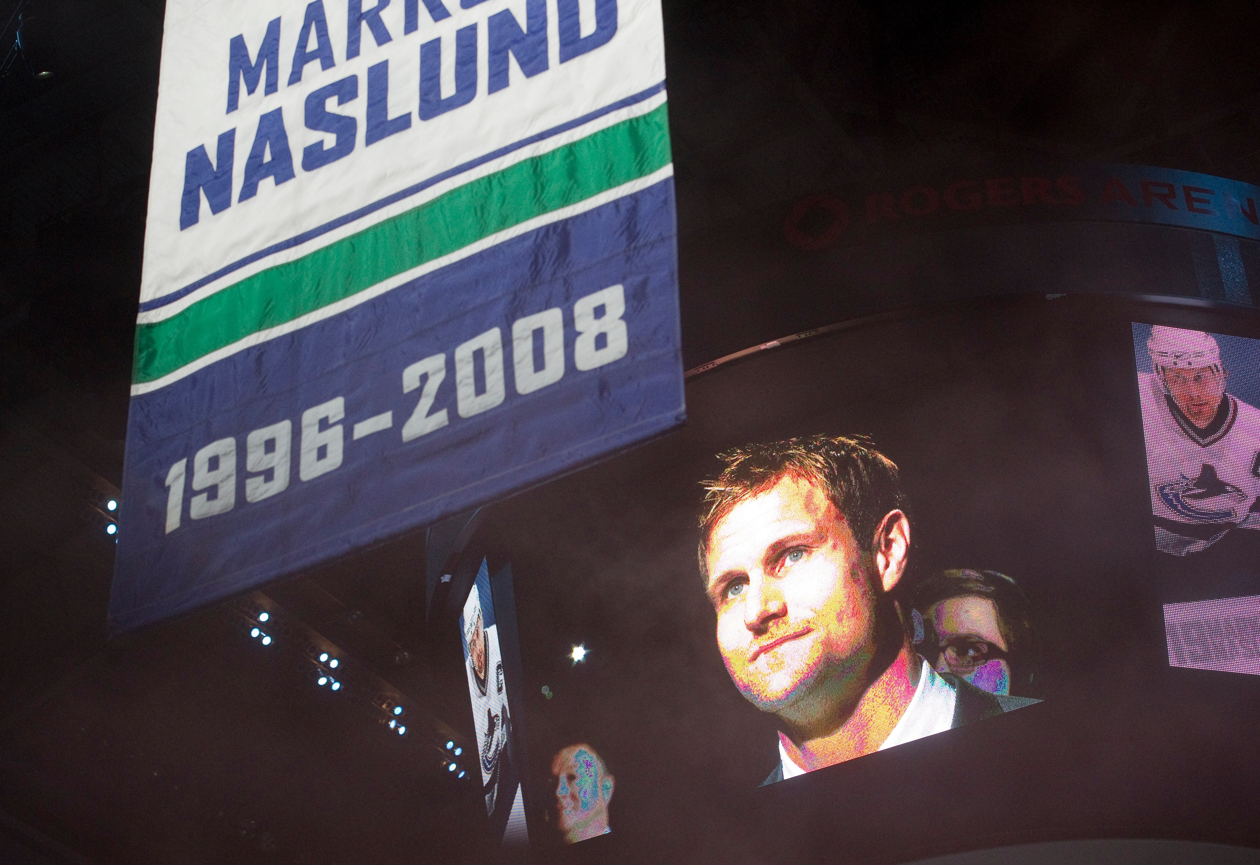 VANCOUVER, CANADA - DECEMBER 11: Markus Naslund formerly of the of the Vancouver Canucks watches his number rise to the rafters during a ceremony where the team retired his jersey prior to NHL action against the Tampa Bay Lightning on December 11, 2010 at