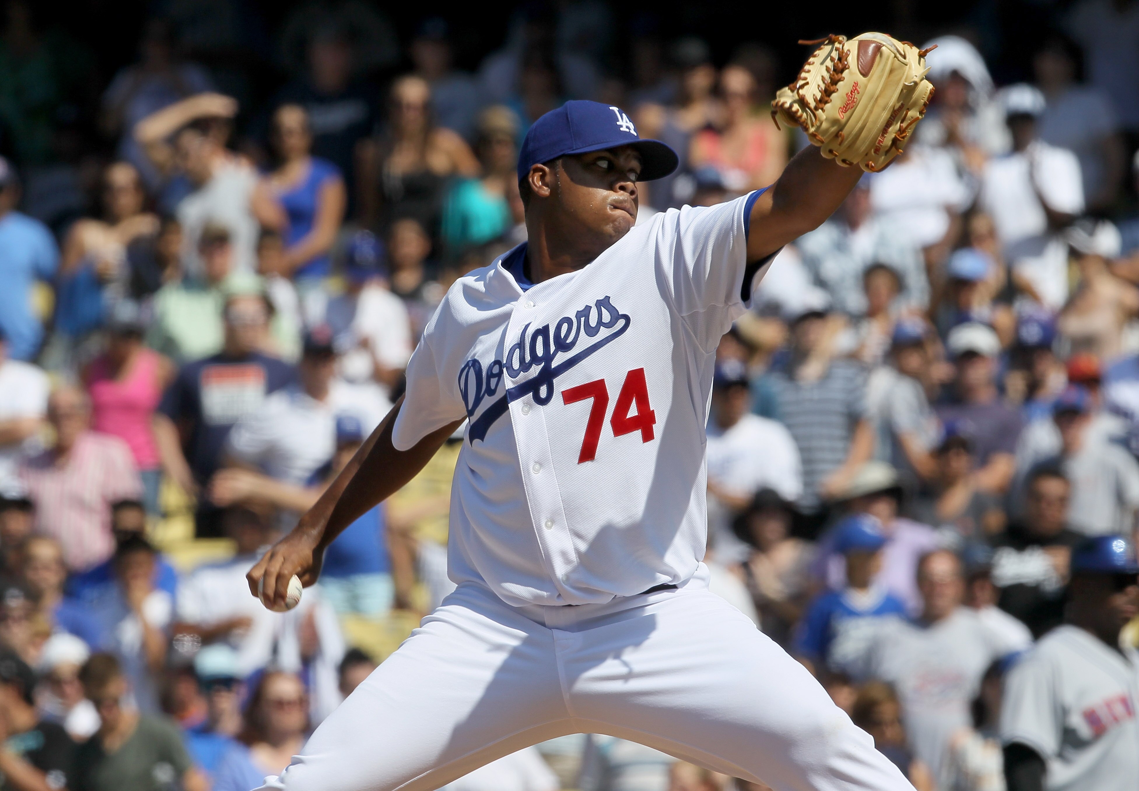 LOS ANGELES, CA - JULY 25:  Pitcher Kenley Jansen #74 of the Los Angeles Dodgers throws a pitch in the ninth inning on his way to picking up his first major league save in the game against the New York Mets on July 25, 2010 at Dodger Stadium in Los Angele