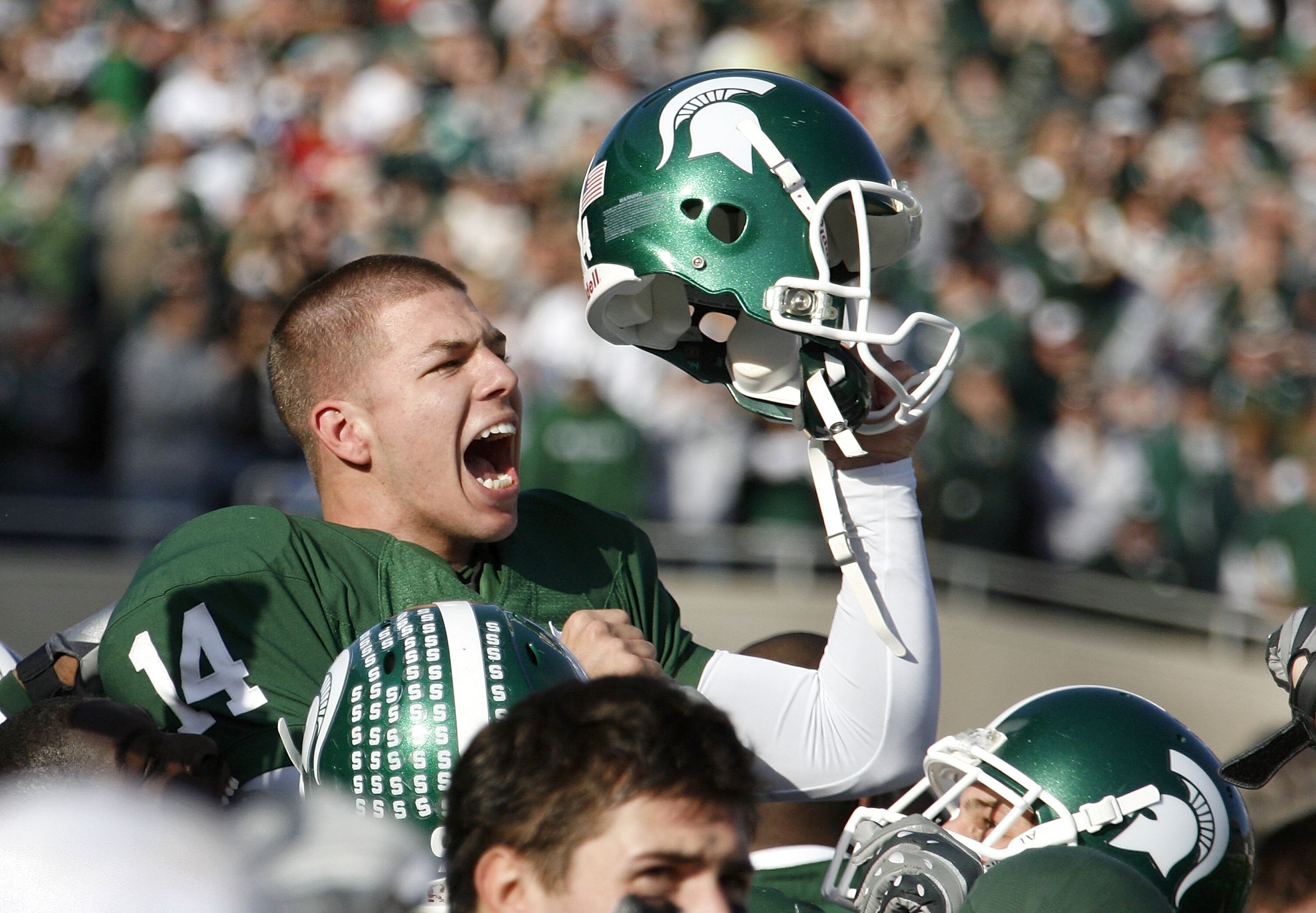 EAST LANSING, MI - NOVEMBER 01:  Brett Swenson #14 of the Michigan State Spartans reacts on his teammates shoulders after kicking game winning field goal to beat the Wisconsin Badgers 25-24 on November 1, 2008 at Spartan Stadium in East Lansing, Michigan.
