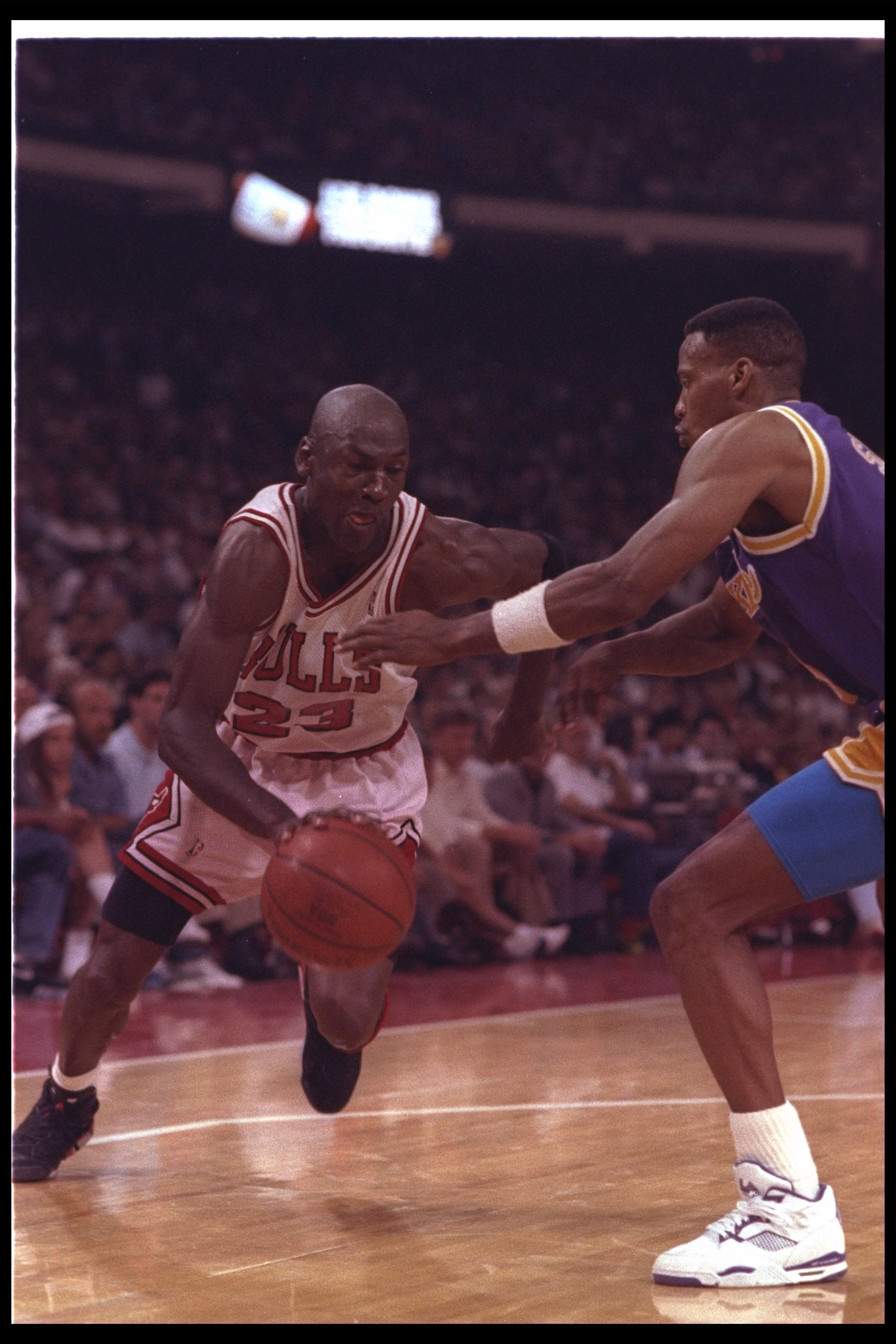 2 May 1991: Guard Michael Jordan of the Chicago Bulls (left) moves against the Los Angeles Lakers during Game One of the NBA finals at the United Center in Chicago, Illinois. The Lakers won the game, 93-91.