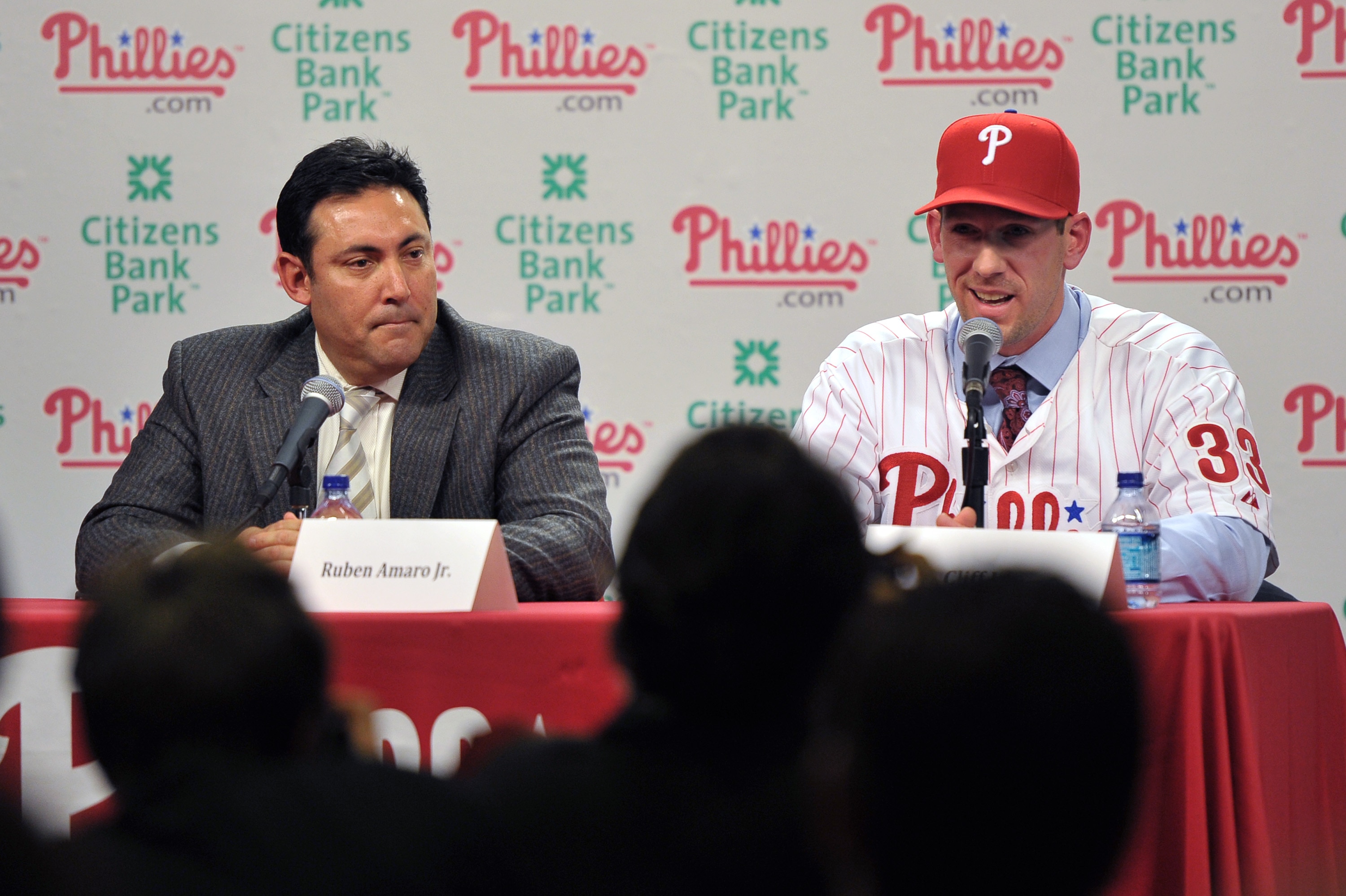 PHILADELPHIA - DECEMBER 15: Pitcher Cliff Lee #33 of the Philadelphia Phillies talks with the media while general manager Ruben Amaro Jr. (L) watches during a press conference at Citizens Bank Park on December 15, 2010 in Philadelphia, Pennsylvania. (Phot