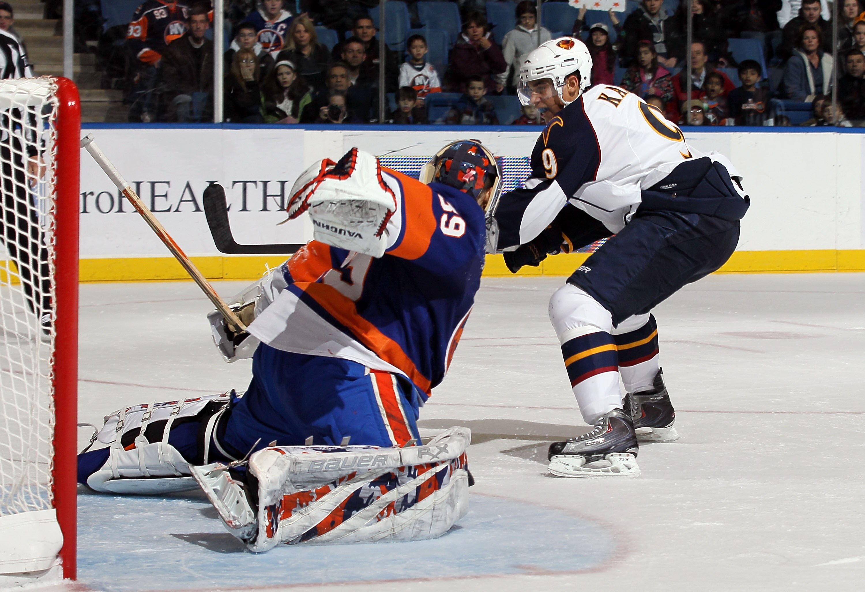 UNIONDALE, NY - DECEMBER 11:  Rick DiPietro #39 of the New York Islanders makes a penalty shot save against Evander Kane #9 of the Atlanta Thrashers during the third period on December 11, 2010 at Nassau Coliseum in Uniondale, New York. The Thrashers defe
