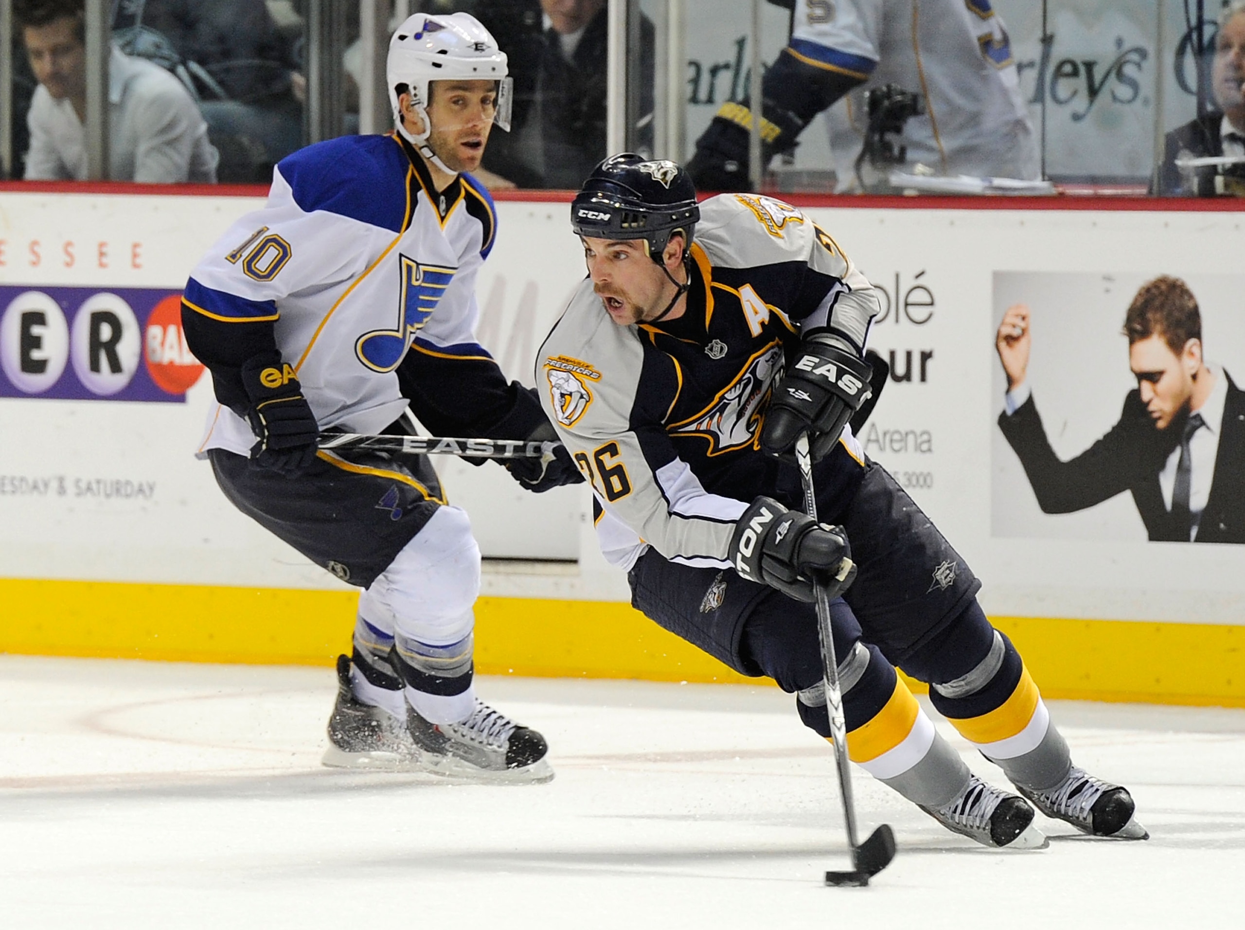 NASHVILLE, TN - NOVEMBER 24:  Steve Sullivan #26 of the Nashville Predators skates against Andy McDonald #10 of the St. Louis Blues on November 24, 2010 at the Bridgestone Arena in Nashville, Tennessee.  (Photo by Frederick Breedon/Getty Images)