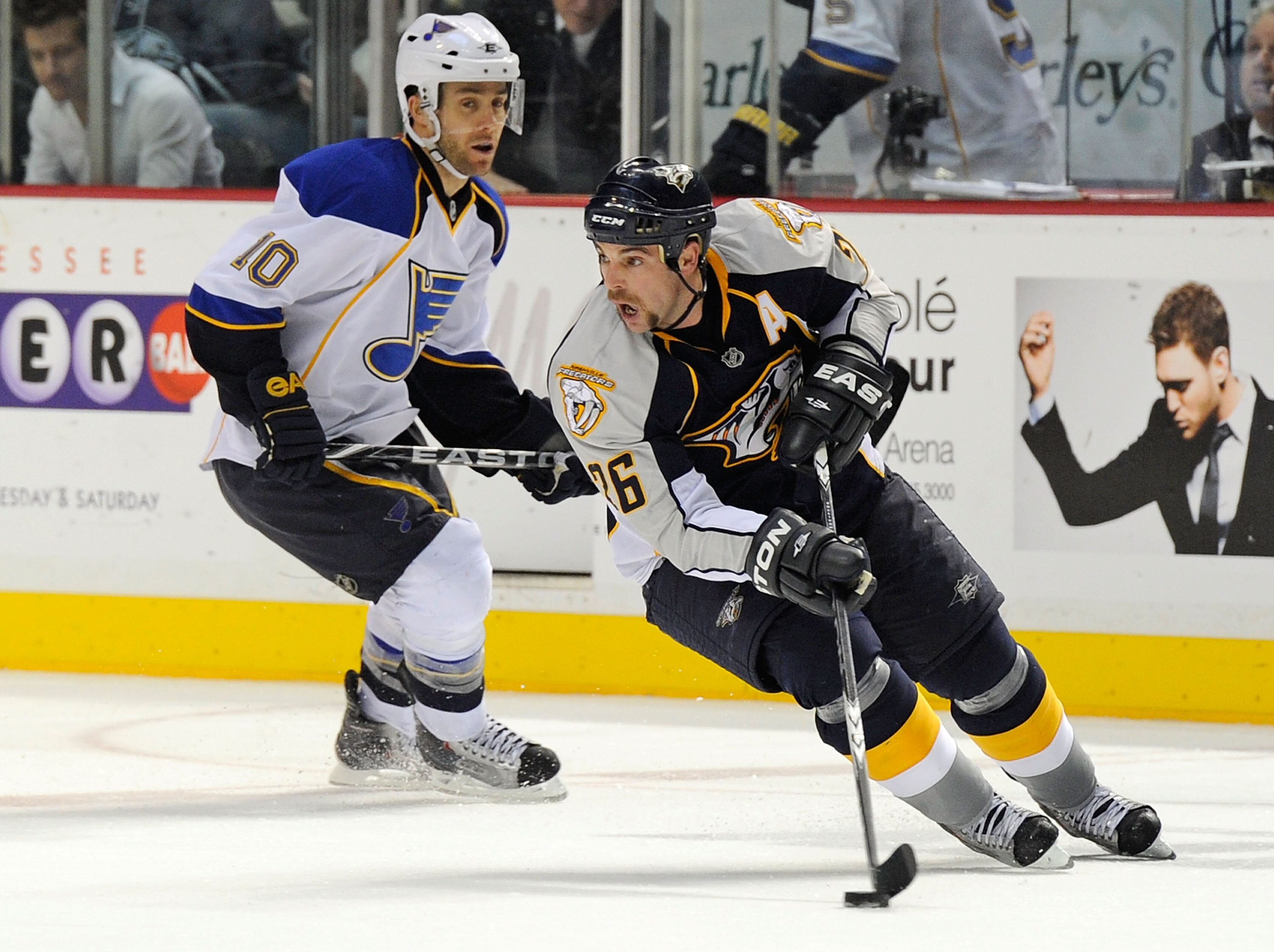 NASHVILLE, TN - NOVEMBER 24:  Steve Sullivan #26 of the Nashville Predators skates against Andy McDonald #10 of the St. Louis Blues on November 24, 2010 at the Bridgestone Arena in Nashville, Tennessee.  (Photo by Frederick Breedon/Getty Images)