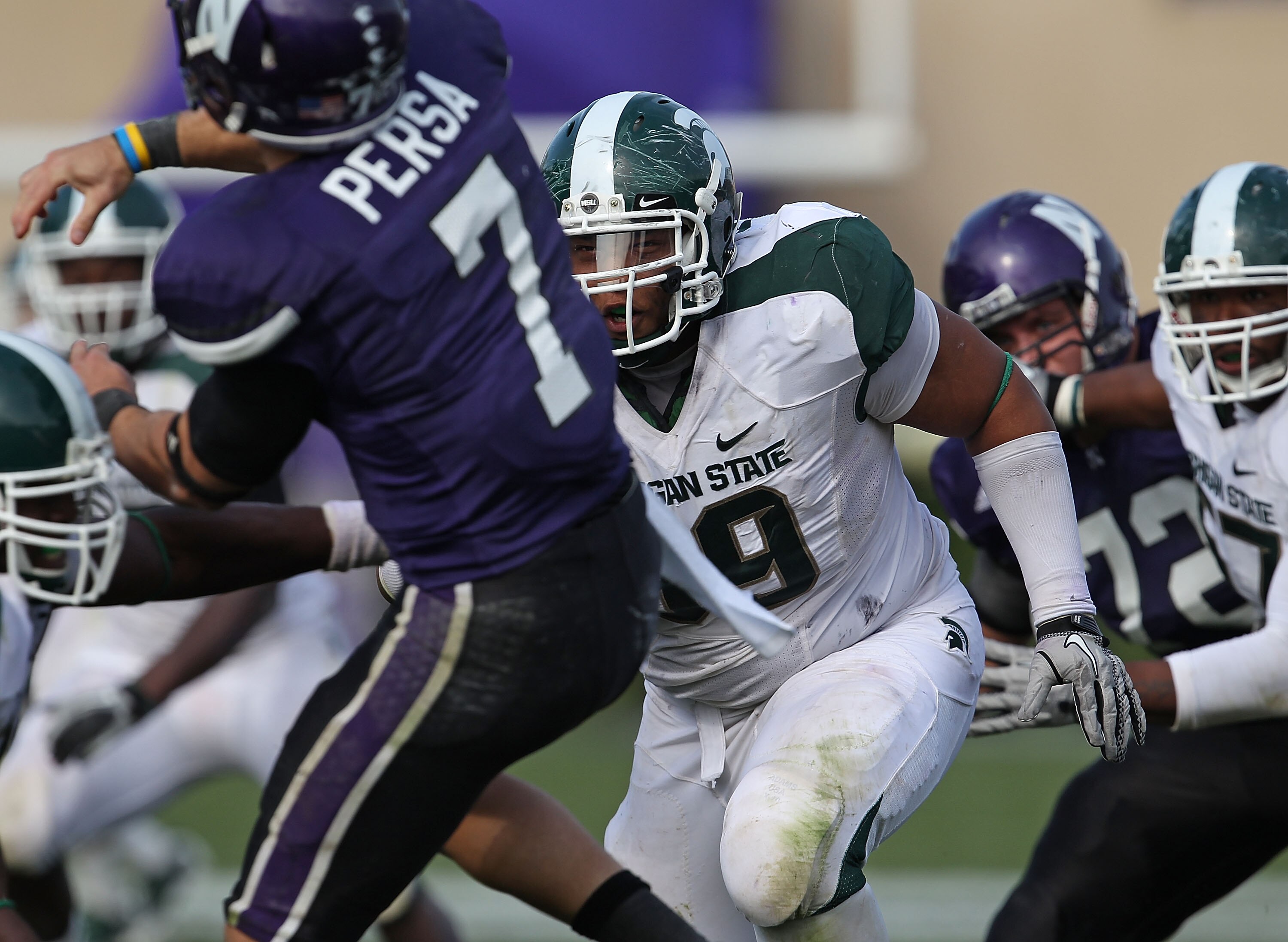 EVANSTON, IL - OCTOBER 23: Jerel Worthy #99 of the Michigan State Spartans rushes towards Dan Persa #7 of the Northwestern Wildcats at Ryan Field on October 23, 2010 in Evanston, Illinois. Michigan State defeated Northwestern 35-27. (Photo by Jonathan Dan