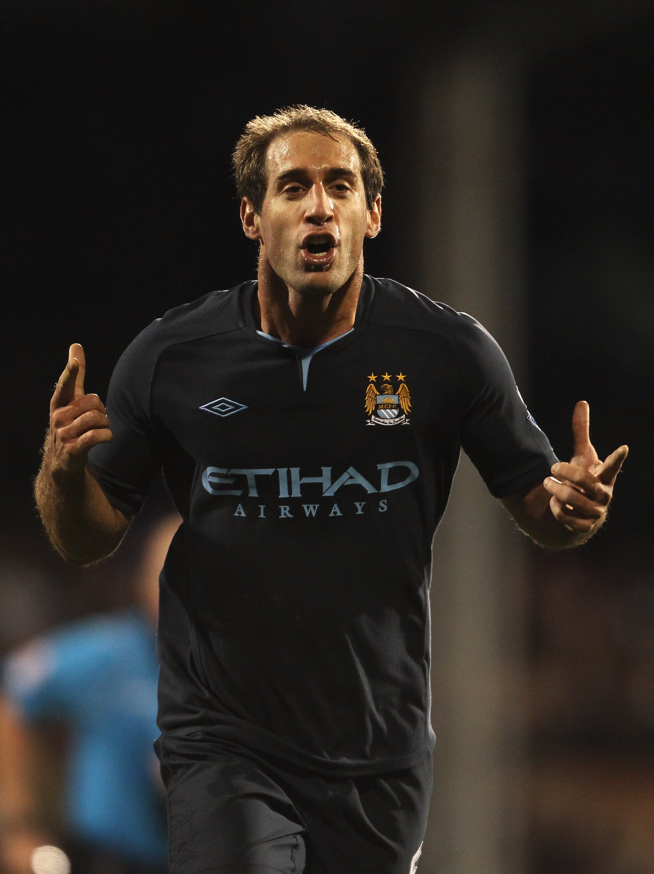 LONDON, ENGLAND - NOVEMBER 21: Pablo Zabaleta of Manchester City celebrates scoring his teams second goal during the Barclays Premier League match between Fulham and Manchester City at Craven Cottage on November 21, 2010 in London, England.  (Photo by Sco