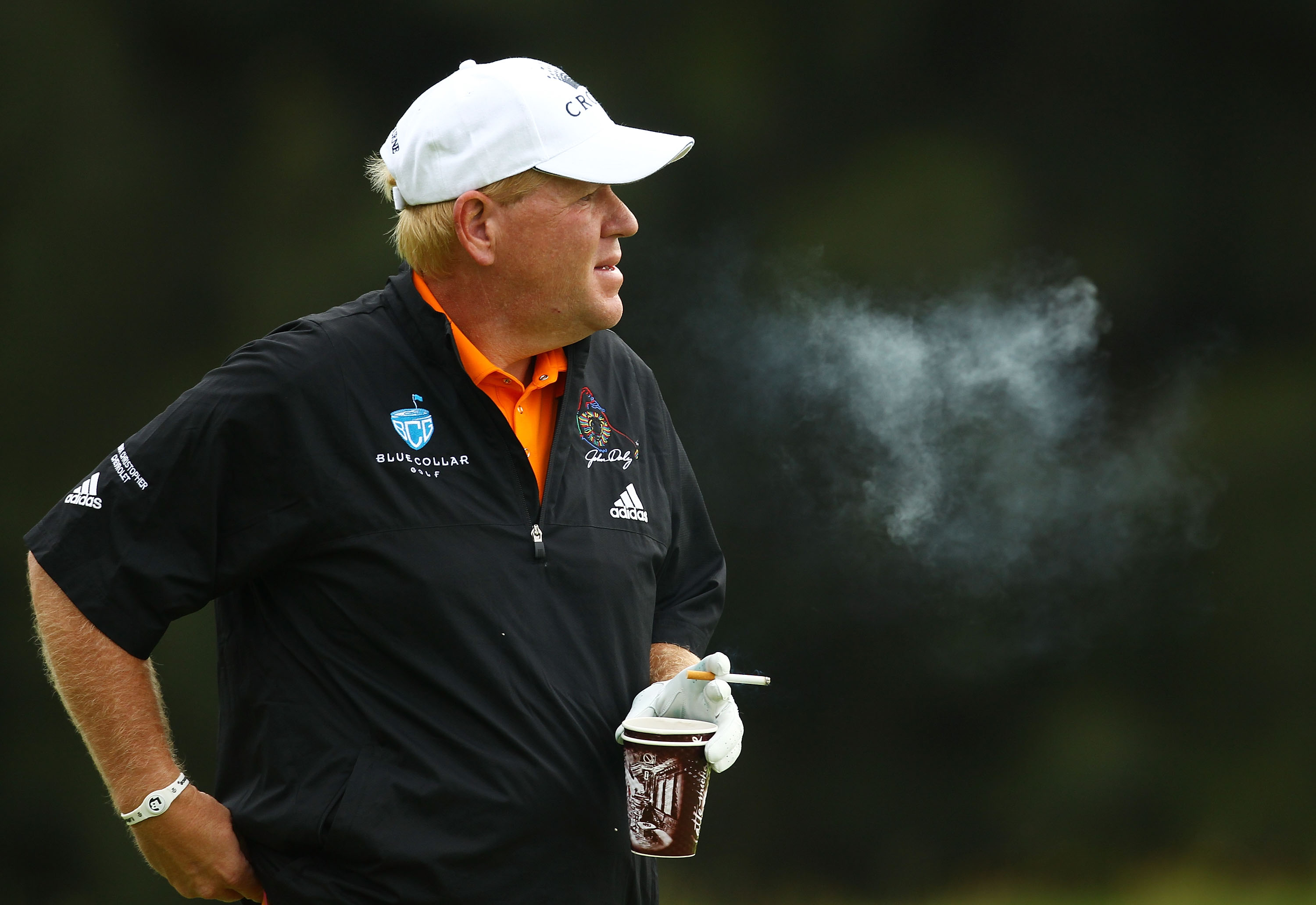 SYDNEY, AUSTRALIA - DECEMBER 02:  John Daly of the United States smokes on the 14th hole during day one of the Australian Open at The Lakes Golf Club on December 2, 2010 in Sydney, Australia.  (Photo by Mark Nolan/Getty Images)