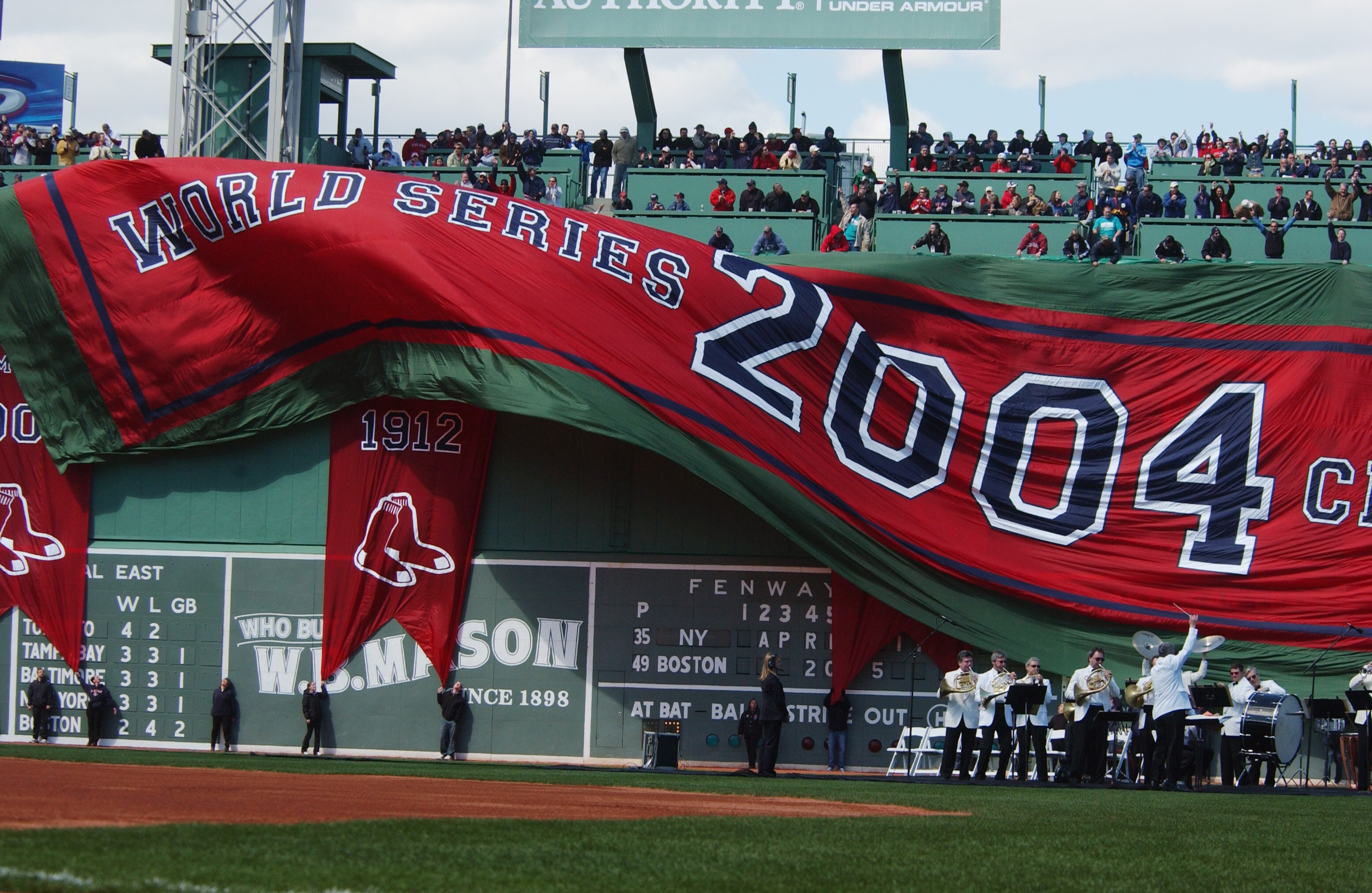 BOSTON - APRIL 11:  The Boston Red Sox 2004 World Series Champions banner is unfurled in a pregame ceremony before the game against the New York Yankees on Opening Day at Fenway Park on April 11, 2005 in Boston, Massachusetts. (Photo by Darren McCollester