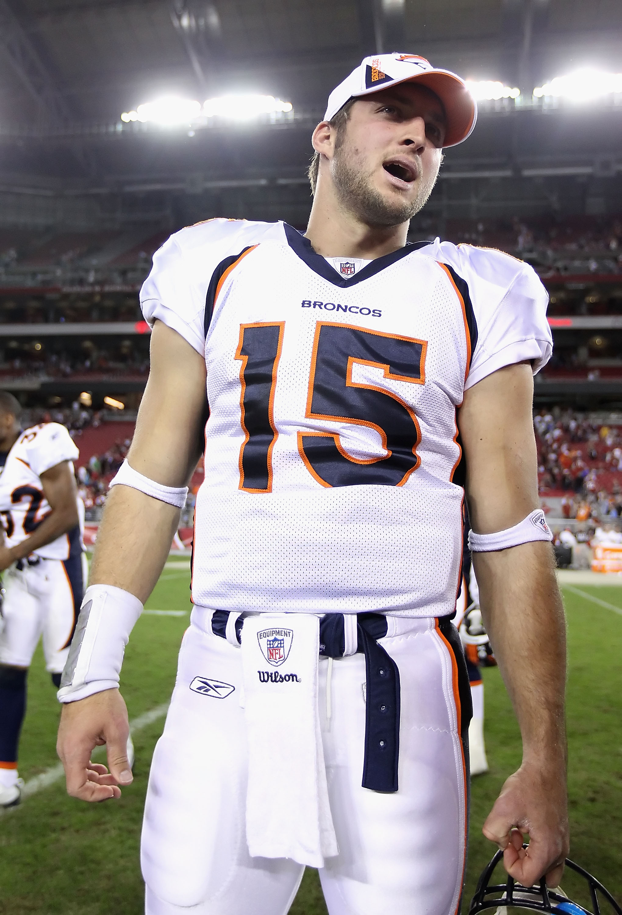 GLENDALE, AZ - DECEMBER 12:  Quarterback Tim Tebow #15 of the Denver Broncos walks off the field following the NFL game against the Arizona Cardinals at the University of Phoenix Stadium on December 12, 2010 in Glendale, Arizona.  The Cardinals defeated t