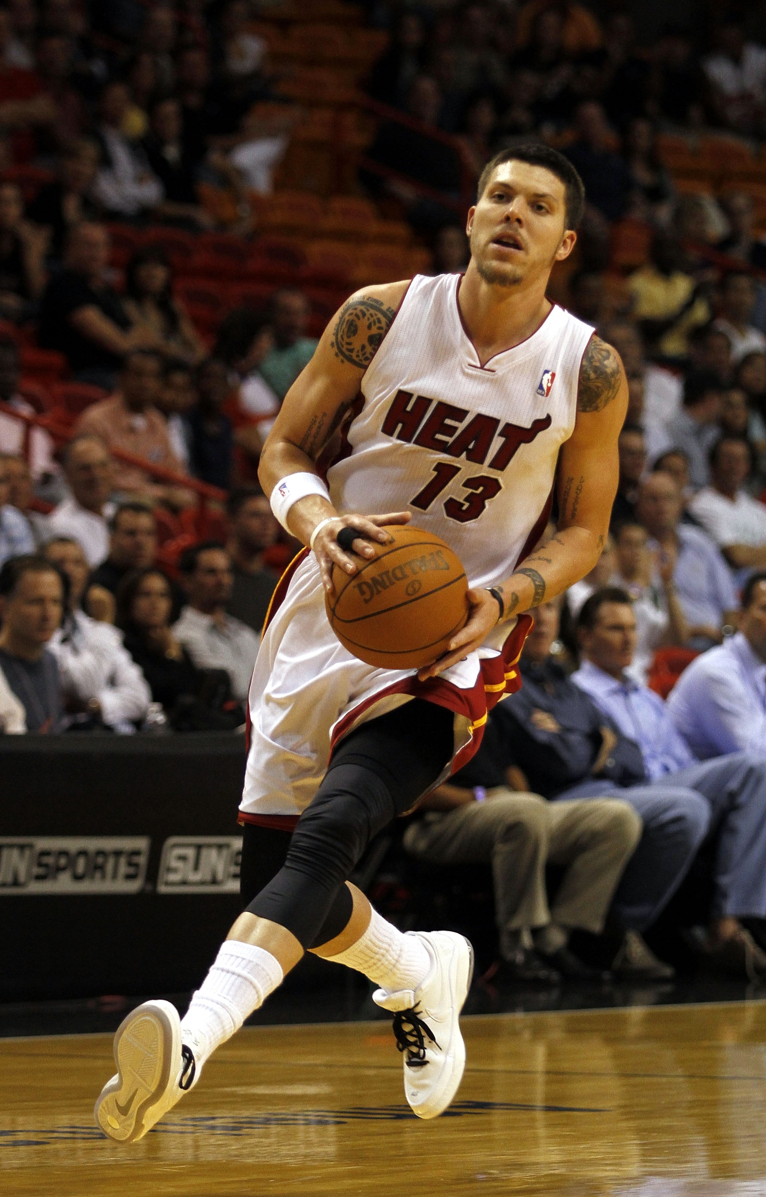 MIAMI - OCTOBER 18:  Forward Mike Miller #13 of the Miami Heat drives against the Charlotte Bobcats on October 18, 2010 at American Airlines Arena in Miami, Florida. NOTE TO USER: User expressly acknowledges and agrees that, by downloading and/or using th