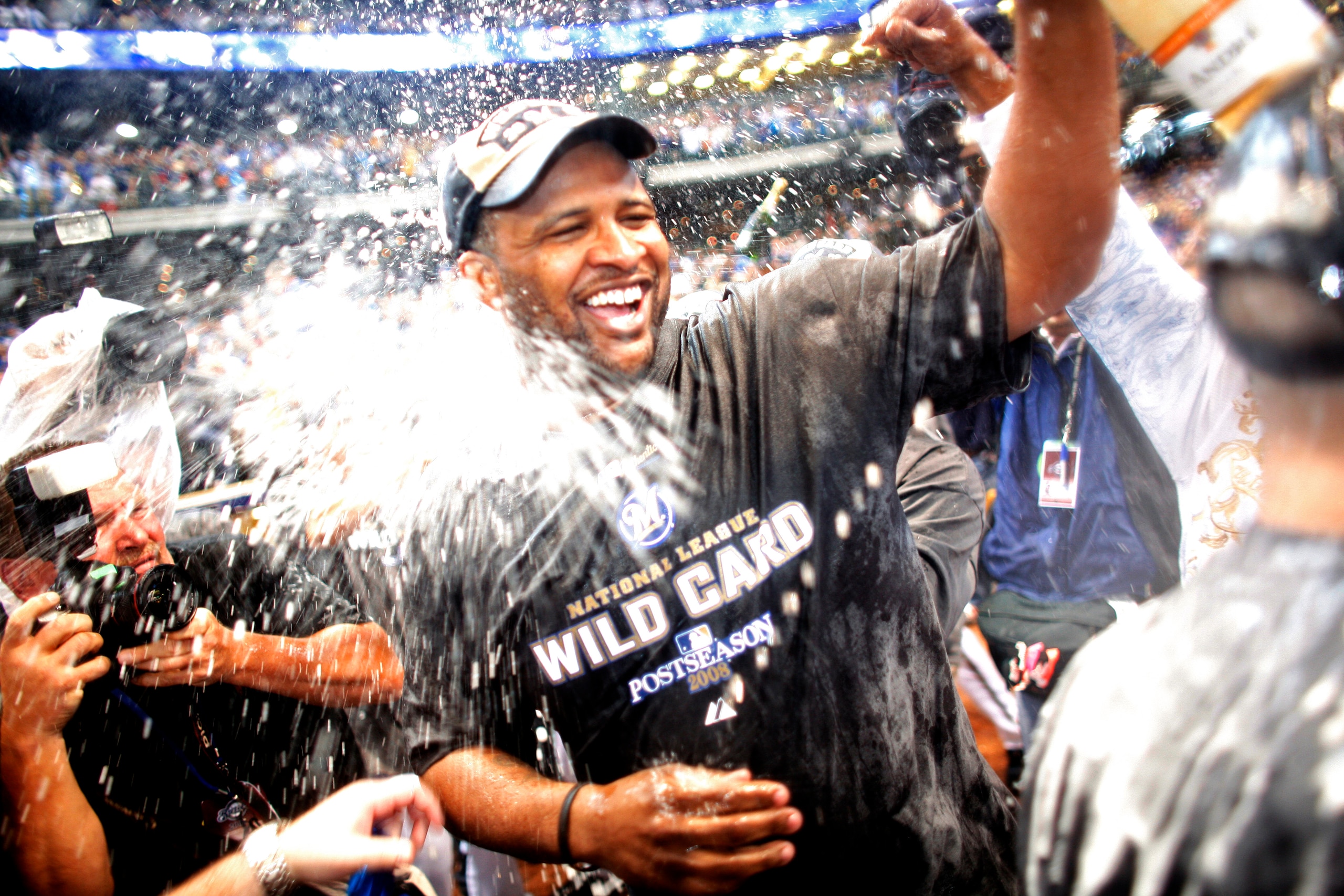 MILWAUKEE - SEPTEMBER 28:  CC Sabathia of the Milwaukee Brewers is sprayed by champaign as he and the Brewers celebrate clinching the National League Wild Card after the game against the Chicago Cubs at Miller Park on September 28, 2008 in Milwaukee, Wisc