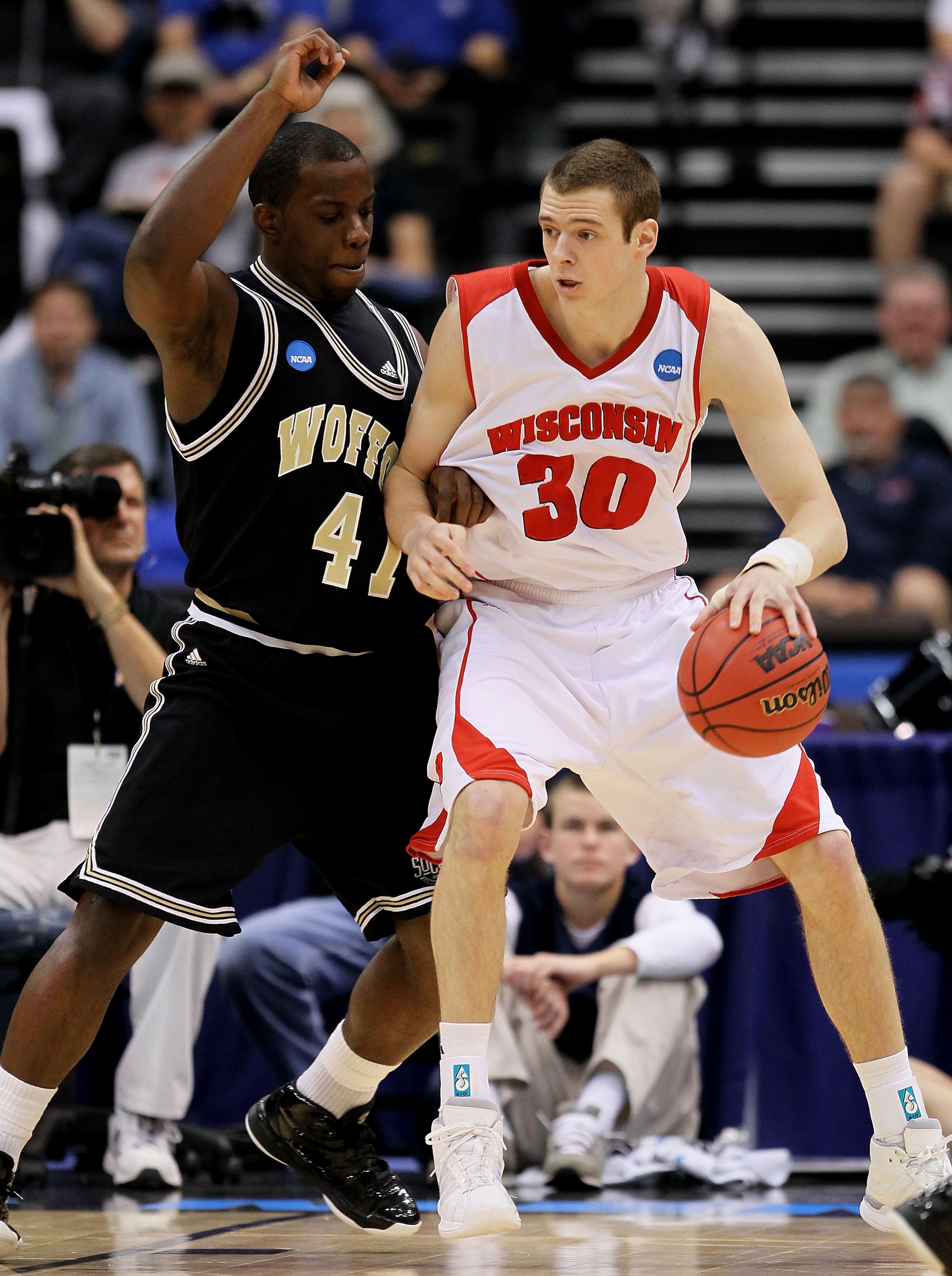 JACKSONVILLE, FL - MARCH 19: Jon Leuer #30 of the Wisconsin Badgers backs down Tim Johnson #41 of the Wofford Terriers during the first round of the 2010 NCAA men's basketball tournament at Jacksonville Veteran's Memorial Arena on March 19, 2010 in Jacks JACKSONVILLE, FL - MARCH 19: Jon Leuer #30 of the Wisconsin Badgers backs down Tim Johnson #41 of the Wofford Terriers during the first round of the 2010 NCAA men's basketball tournament at Jacksonville Veteran's Memorial Arena on March 19, 2010 in Jacks