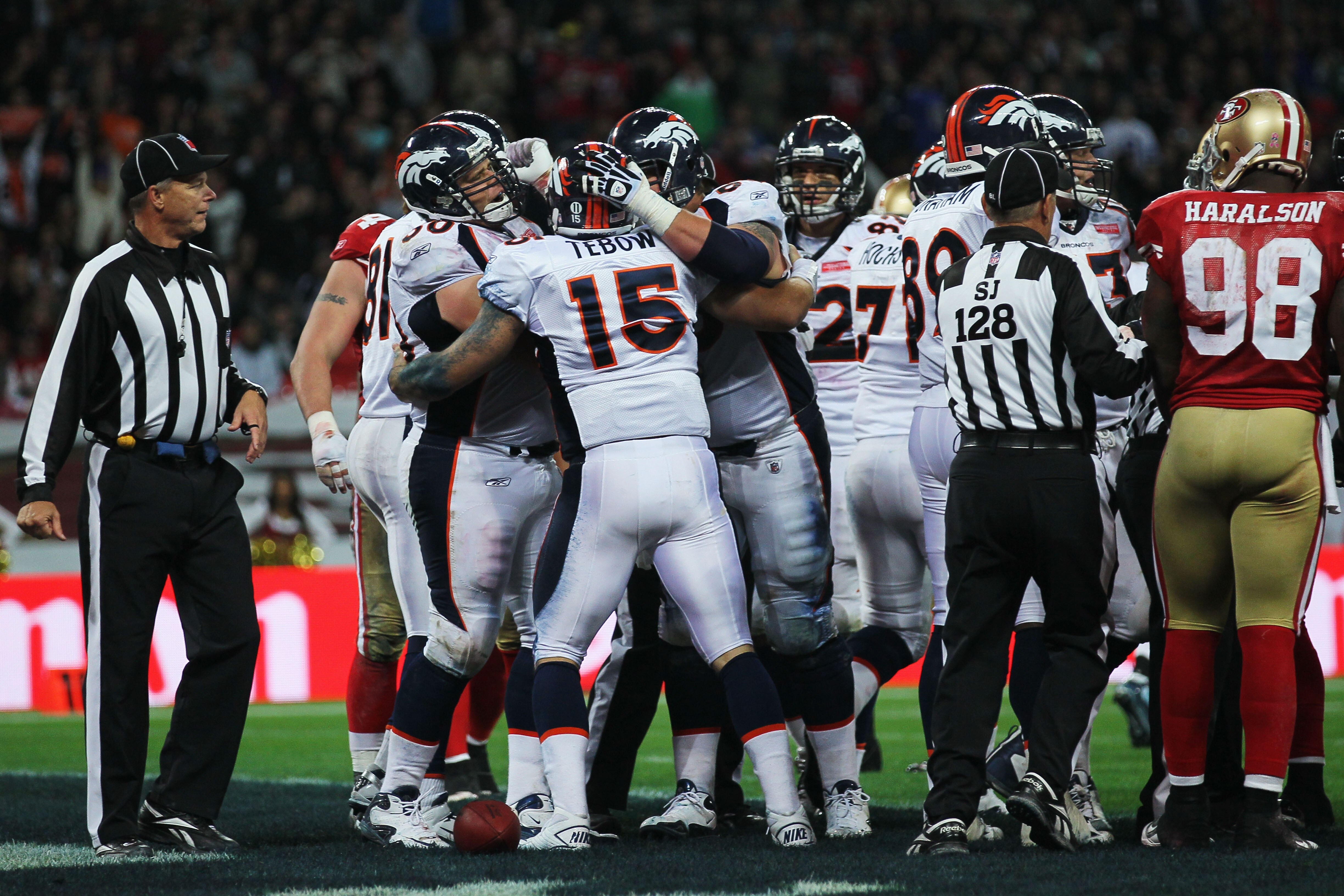 LONDON, ENGLAND - OCTOBER 31:  Tim Tebow #15 of Denver Broncos is congratulated as he scores their first touchdown during the NFL International Series match between Denver Broncos and San Francisco 49ers at Wembley Stadium on October 31, 2010 in London, E