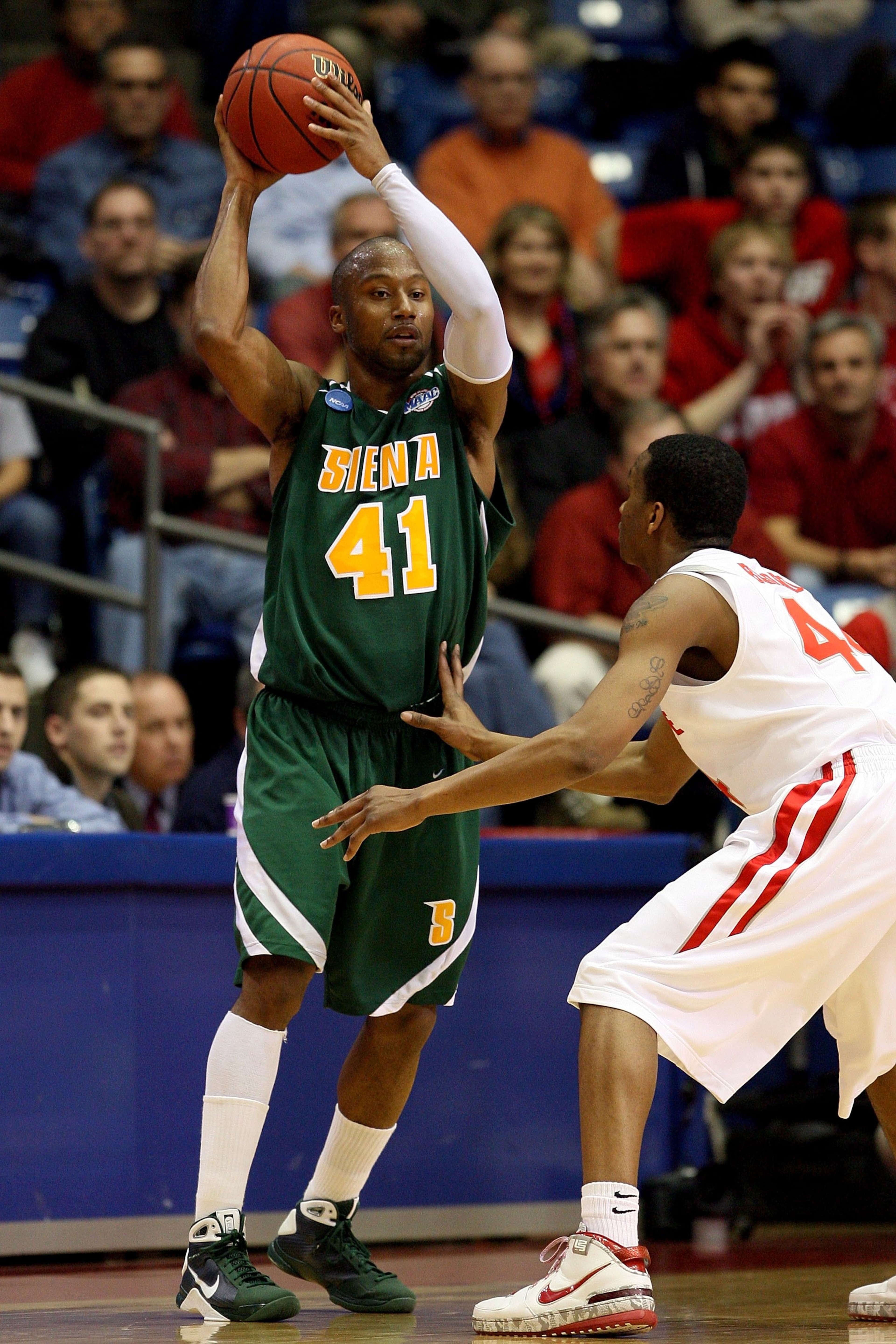 DAYTON, OH - MARCH 20: Kenny Hasbrouck of the Siena Saints handles the ball against William Buford #44 of the Ohio State Buckeyes during the first round of the NCAA Division I Men's Basketball Tournament at the University of Dayton Arena on March 20, 2009