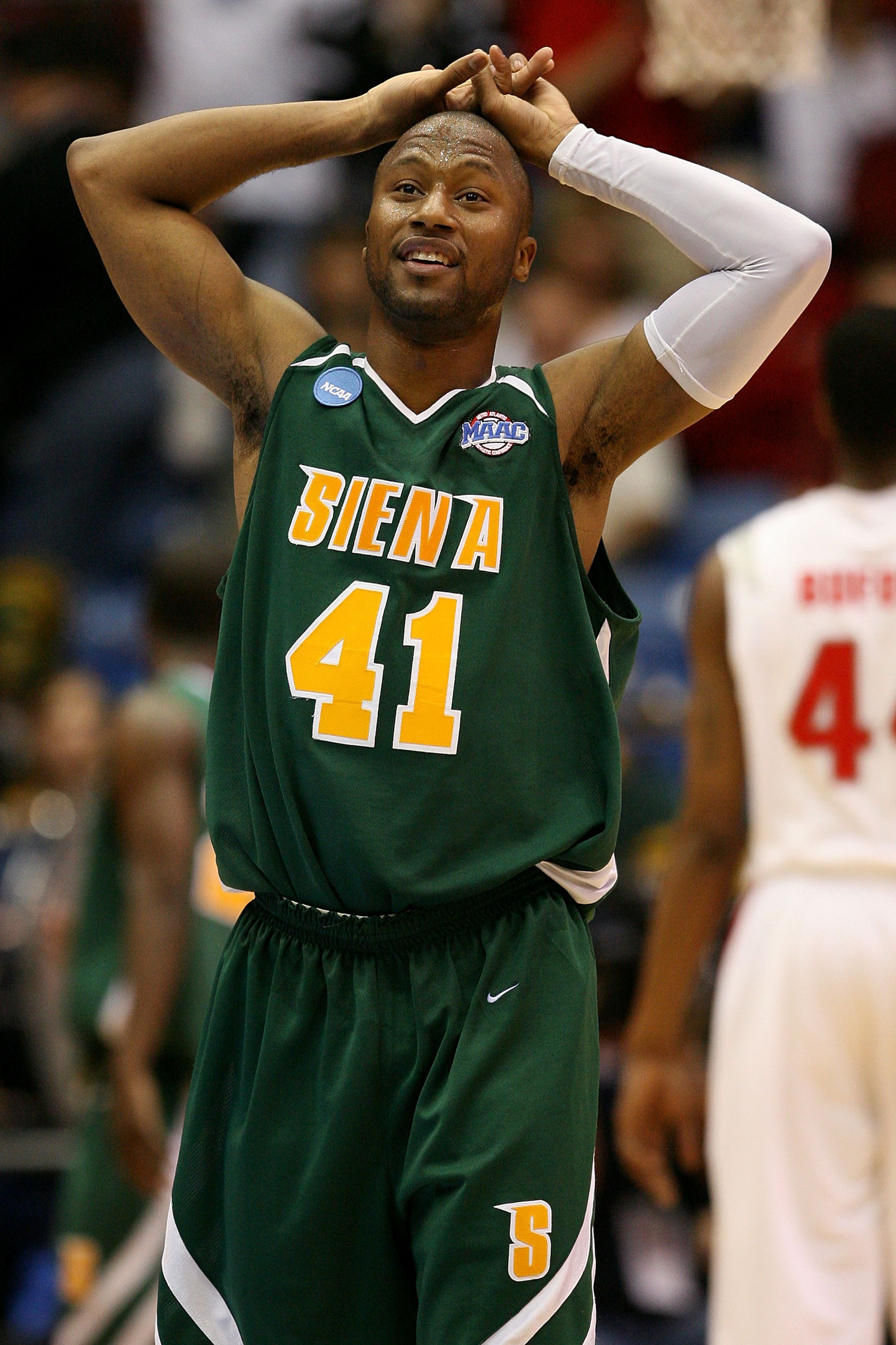 DAYTON, OH - MARCH 20: Kenny Hasbrouck #41 of the Siena Saints looks on between plays against the Ohio State Buckeyes during the first round of the NCAA Division I Men's Basketball Tournament at the University of Dayton Arena on March 20, 2009 in Dayton, DAYTON, OH - MARCH 20: Kenny Hasbrouck #41 of the Siena Saints looks on between plays against the Ohio State Buckeyes during the first round of the NCAA Division I Men's Basketball Tournament at the University of Dayton Arena on March 20, 2009 in Dayton,