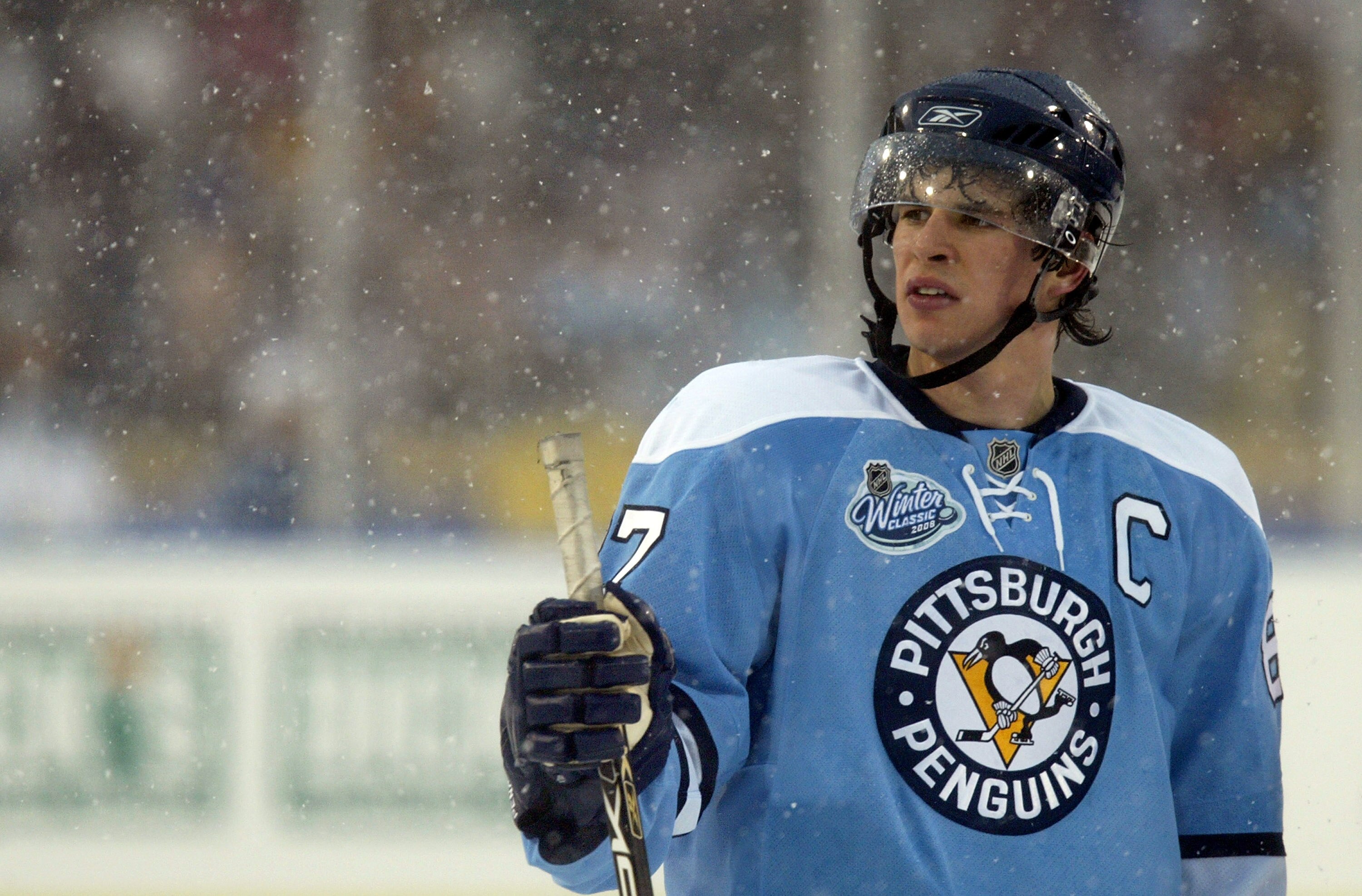 ORCHARD PARK, NY - JANUARY 01:  Snow falls on Sidney Crosby #87 of the Pittsburgh Penguins during the NHL Winter Classic against the Buffalo Sabres at the Ralph Wilson Stadium on January 1, 2008 in Orchard Park, New York.  The Penguins won the game 2-1 in