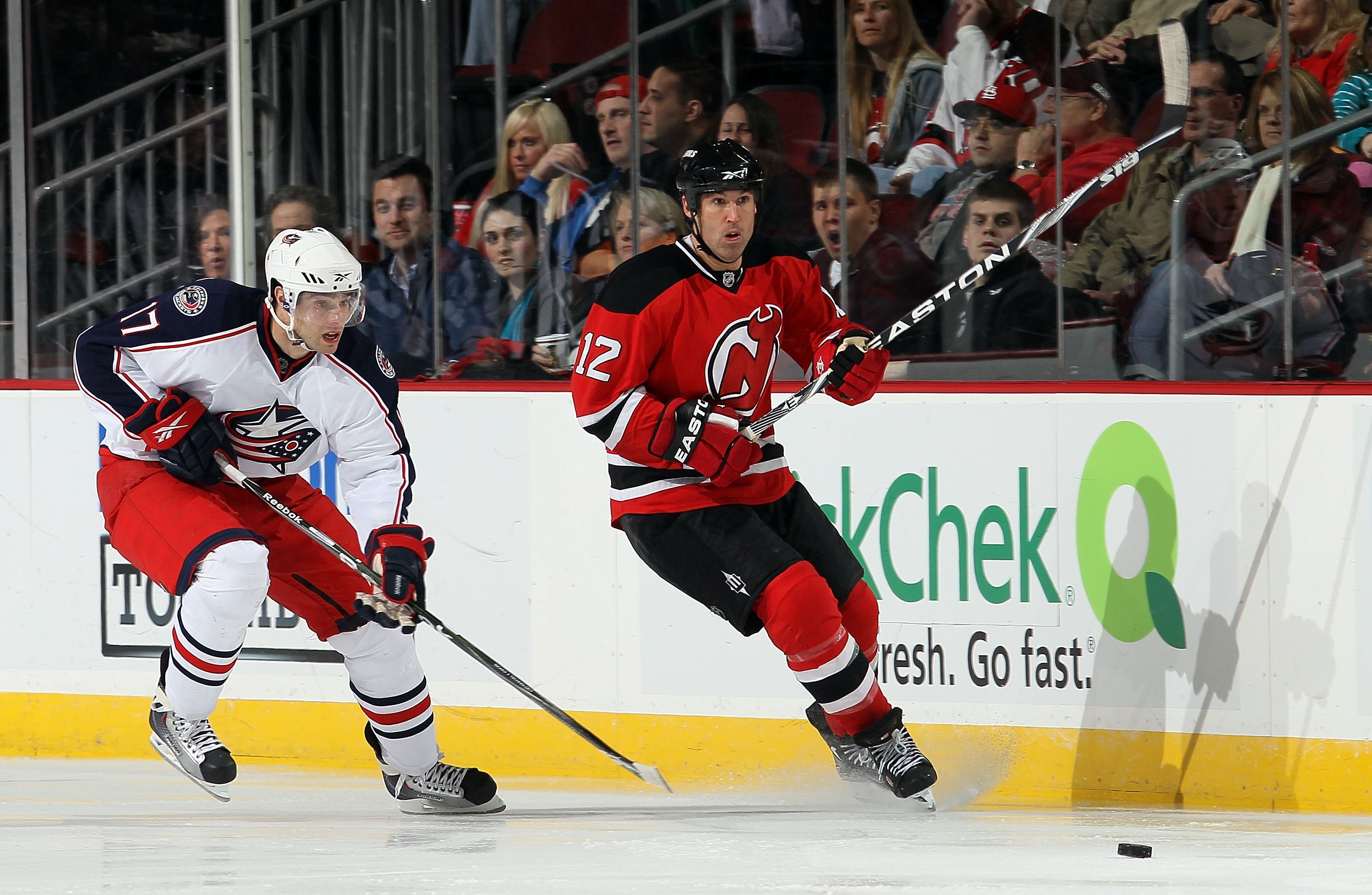 NEWARK, NJ - MARCH 23:  Brian Rolston #12 of the New Jersey Devils skates against Andrew Murray #17 of the Columbus Blue Jackets at the Prudential Center on March 23, 2010 in Newark, New Jersey. The Devils defeated the Blue Jackets 6-3.  (Photo by Jim McI