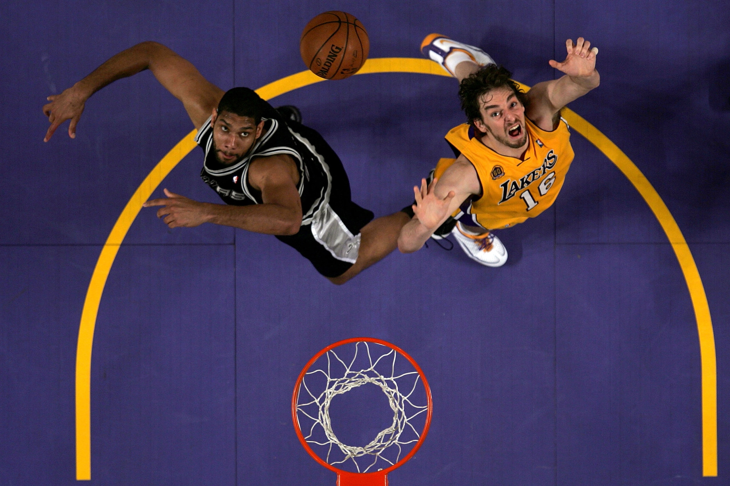 LOS ANGELES, CA - MAY 21: Tim Duncan #21 of the San Antonio Spurs and Pau Gasol #16 of the Los Angeles Lakers go after a rebound in Game One of the Western Conference Finals during the 2008 NBA Playoffs on May 21, 2008 at Staples Center in Los Angeles, C LOS ANGELES, CA - MAY 21: Tim Duncan #21 of the San Antonio Spurs and Pau Gasol #16 of the Los Angeles Lakers go after a rebound in Game One of the Western Conference Finals during the 2008 NBA Playoffs on May 21, 2008 at Staples Center in Los Angeles, C