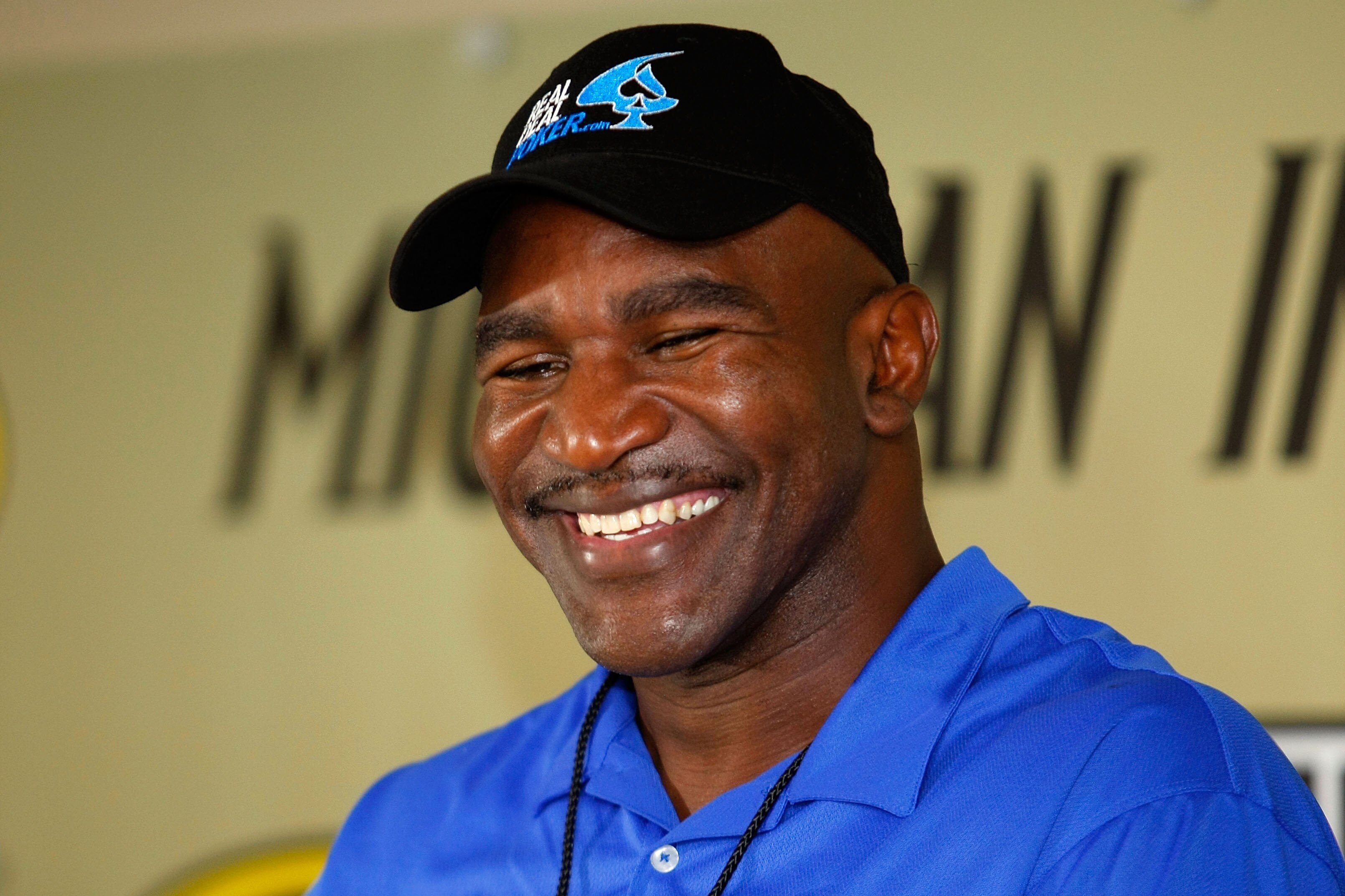 BROOKLYN, MI - AUGUST 15:  Former heavyweight Champion Evander Holyfield speaks at a press conference prior to the NASCAR Sprint Cup Series CARFAX 400 at Michigan International Speedway on August 15, 2010 in Brooklyn, Michigan. Holyfield is the co-Grand M