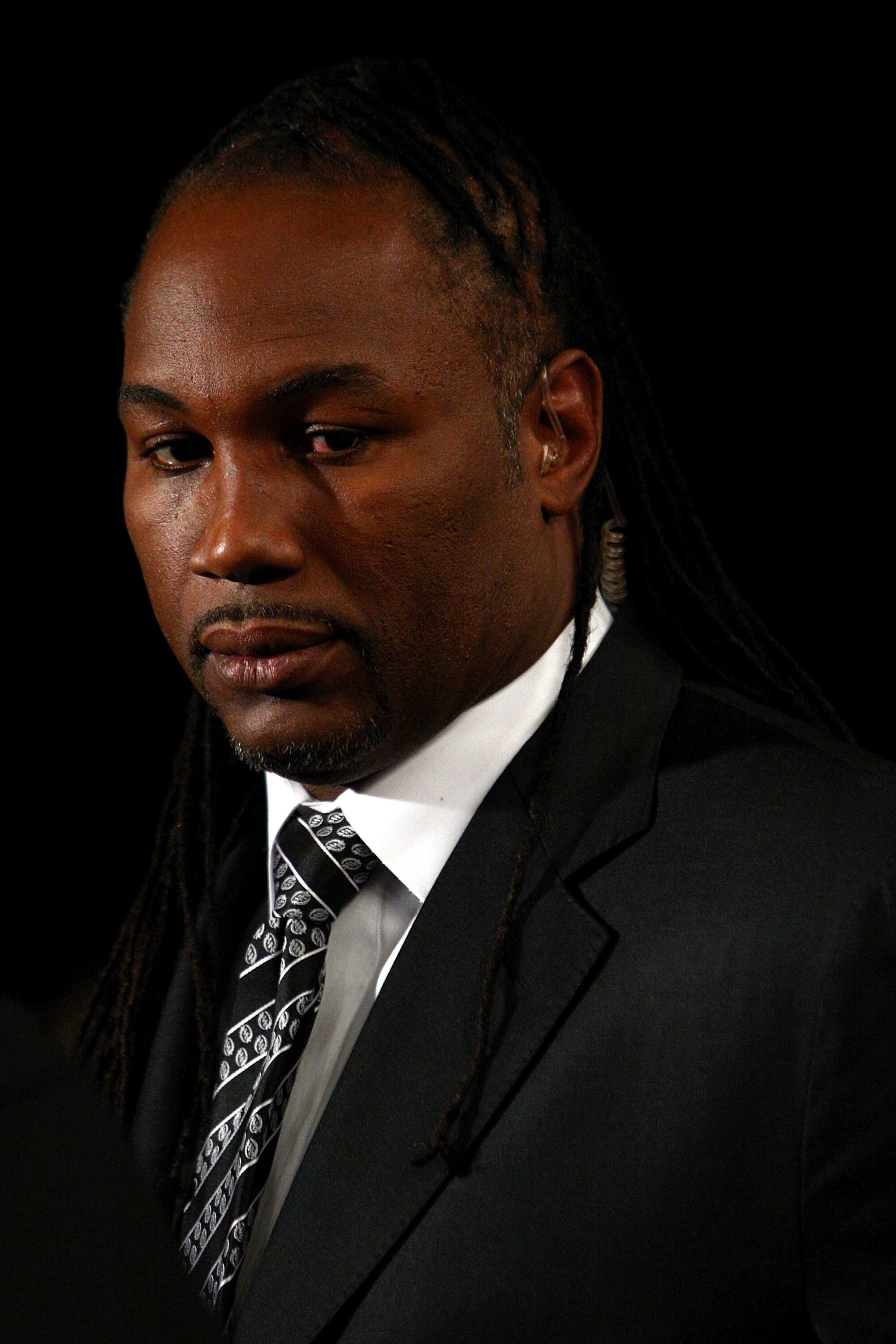 LAS VEGAS - NOVEMBER 22:  Boxer/commentator Lennox Lewis looks on during the fight between Ricky Hatton of England and Paulie Malignaggi during their light-welterweight fight at the MGM Grand Garden Arena November 22, 2008 in Las Vegas, Nevada.  (Photo by