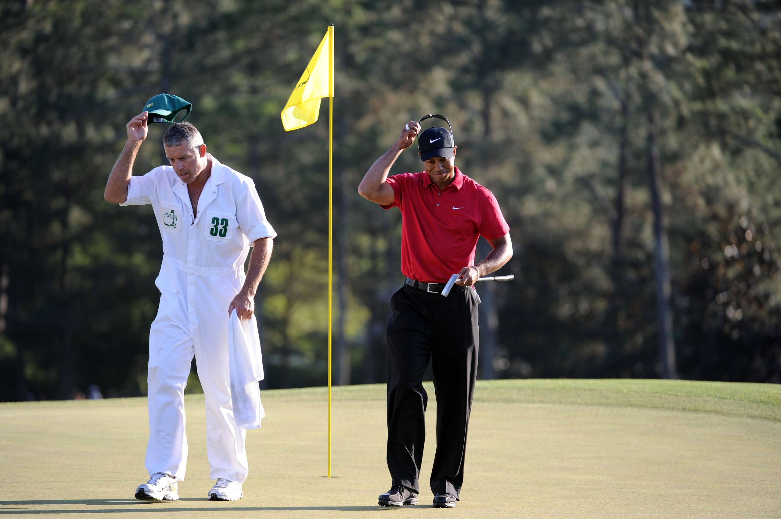AUGUSTA, GA - APRIL 11:  Tiger Woods walks off the 18th green with his caddie Steve Williams during the final round of the 2010 Masters Tournament at Augusta National Golf Club on April 11, 2010 in Augusta, Georgia.  (Photo by Harry How/Getty Images)