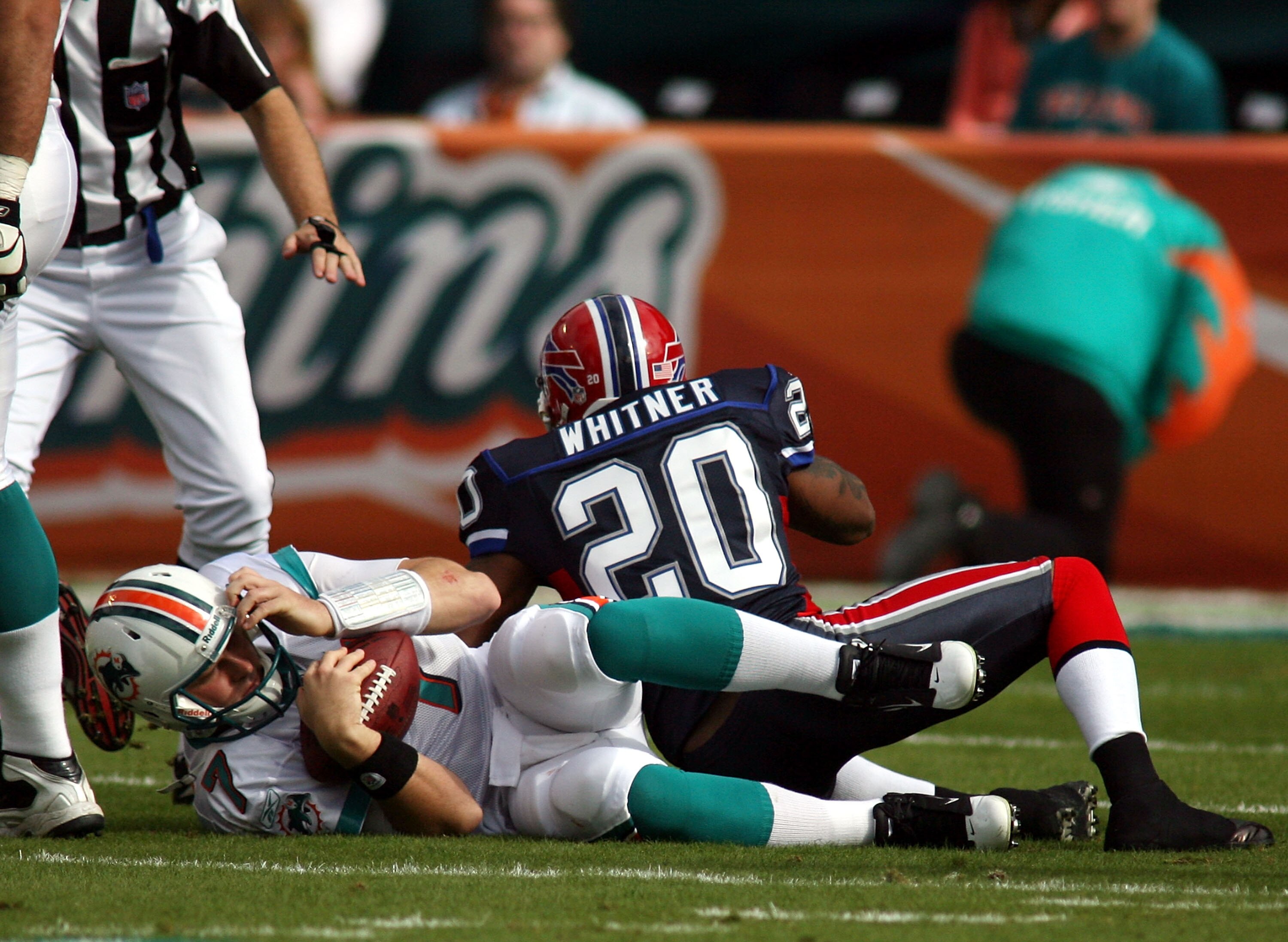MIAMI - DECEMBER 19: Quarterback Chad Henne #7 of the Miami Dolphins is sacked by cornerback Donte Whitner #20 of the Buffalo Bills at Sun Life Stadium on December 19, 2010 in Miami, Florida. The Bills defeated the Dolphins 17-14. (Photo by Marc Serota/Ge