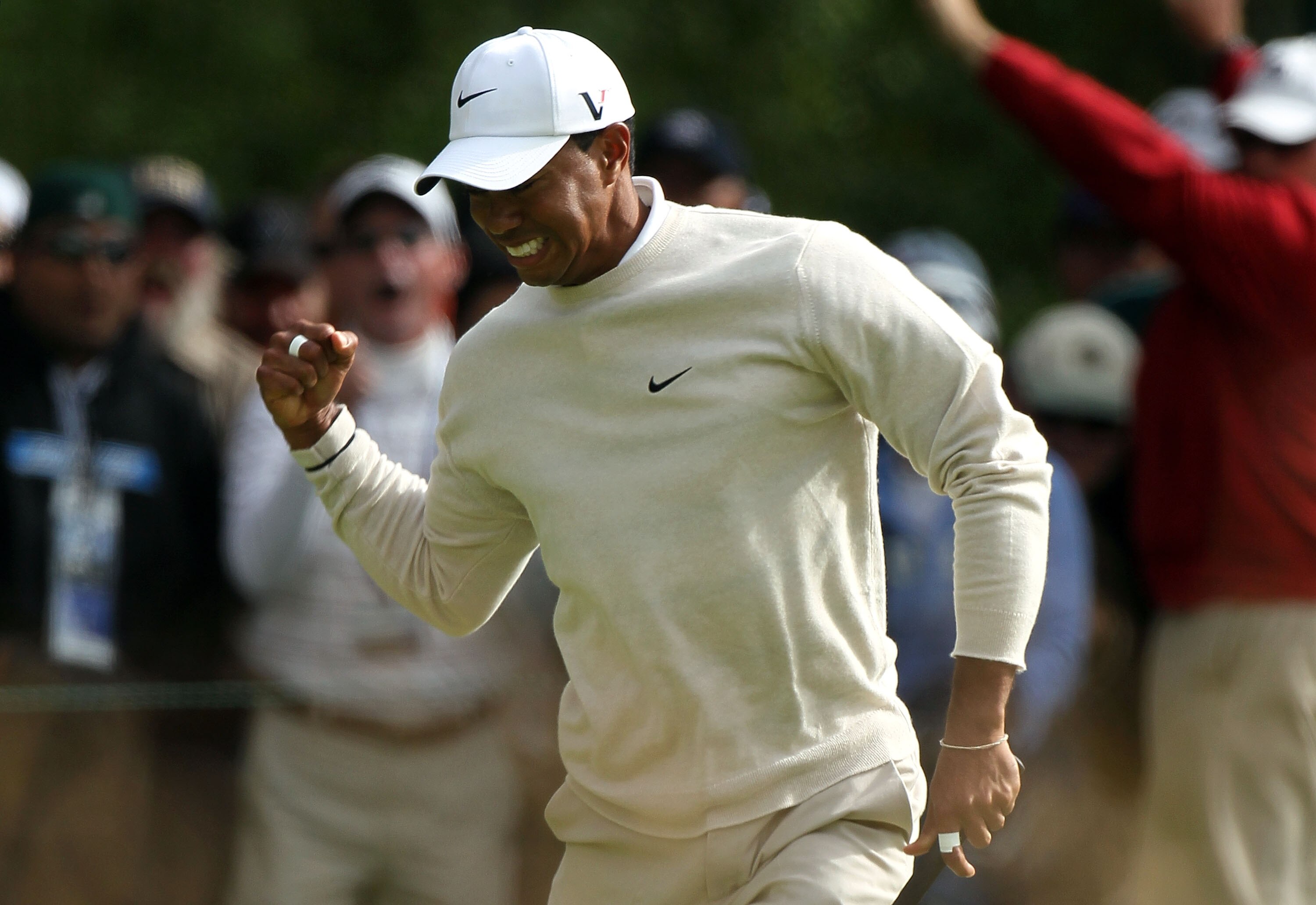 PEBBLE BEACH, CA - JUNE 19:  Tiger Woods  celebrates a birdie putt on the 16th green during the third round of the 110th U.S. Open at Pebble Beach Golf Links on June 19, 2010 in Pebble Beach, California.  (Photo by Stephen Dunn/Getty Images)