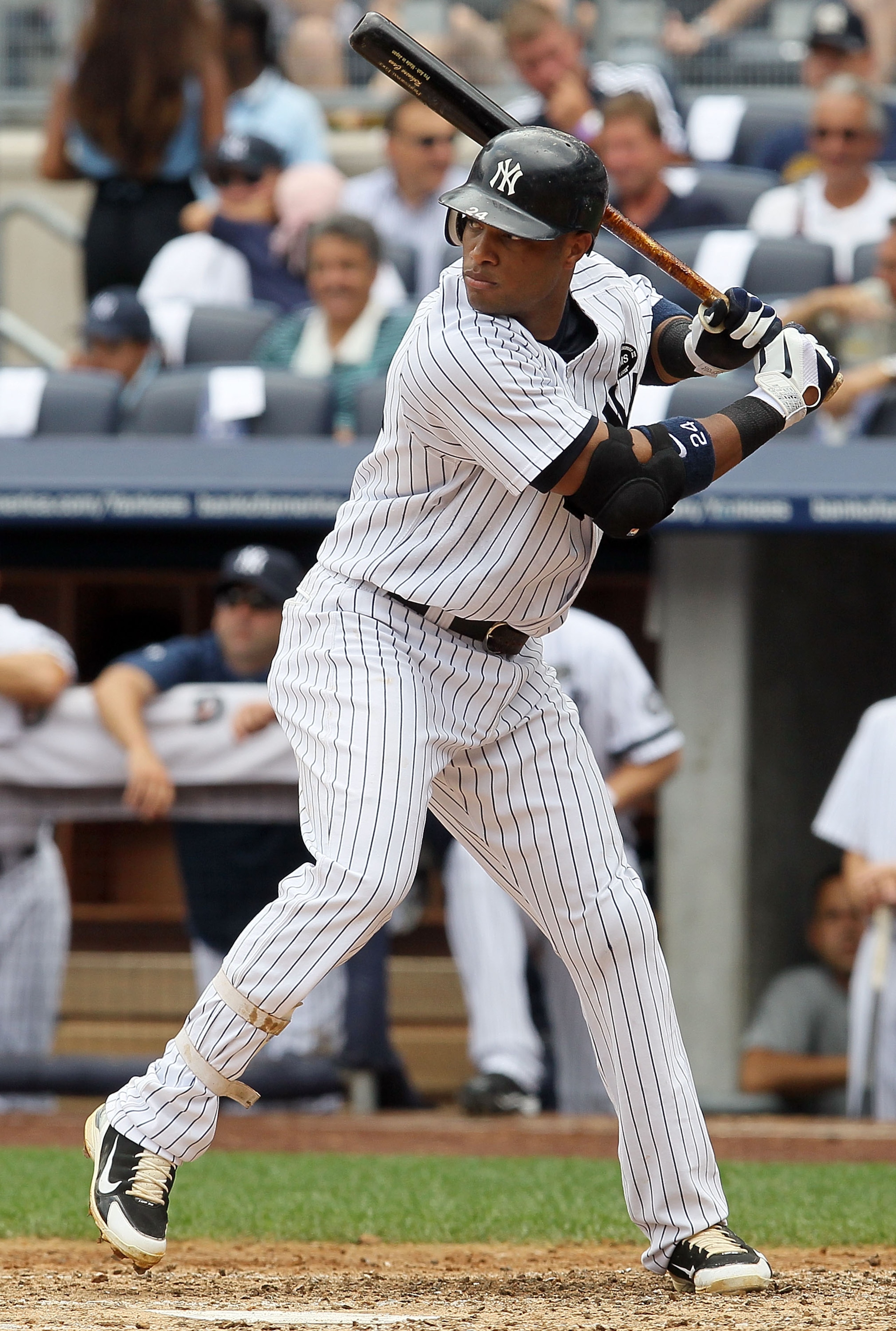 NEW YORK - AUGUST 04:  Robinson Cano #24 of the New York Yankees bats against the Toronto Blue Jays on August 4, 2010 at Yankee Stadium in the Bronx borough of New York City.  (Photo by Jim McIsaac/Getty Images)