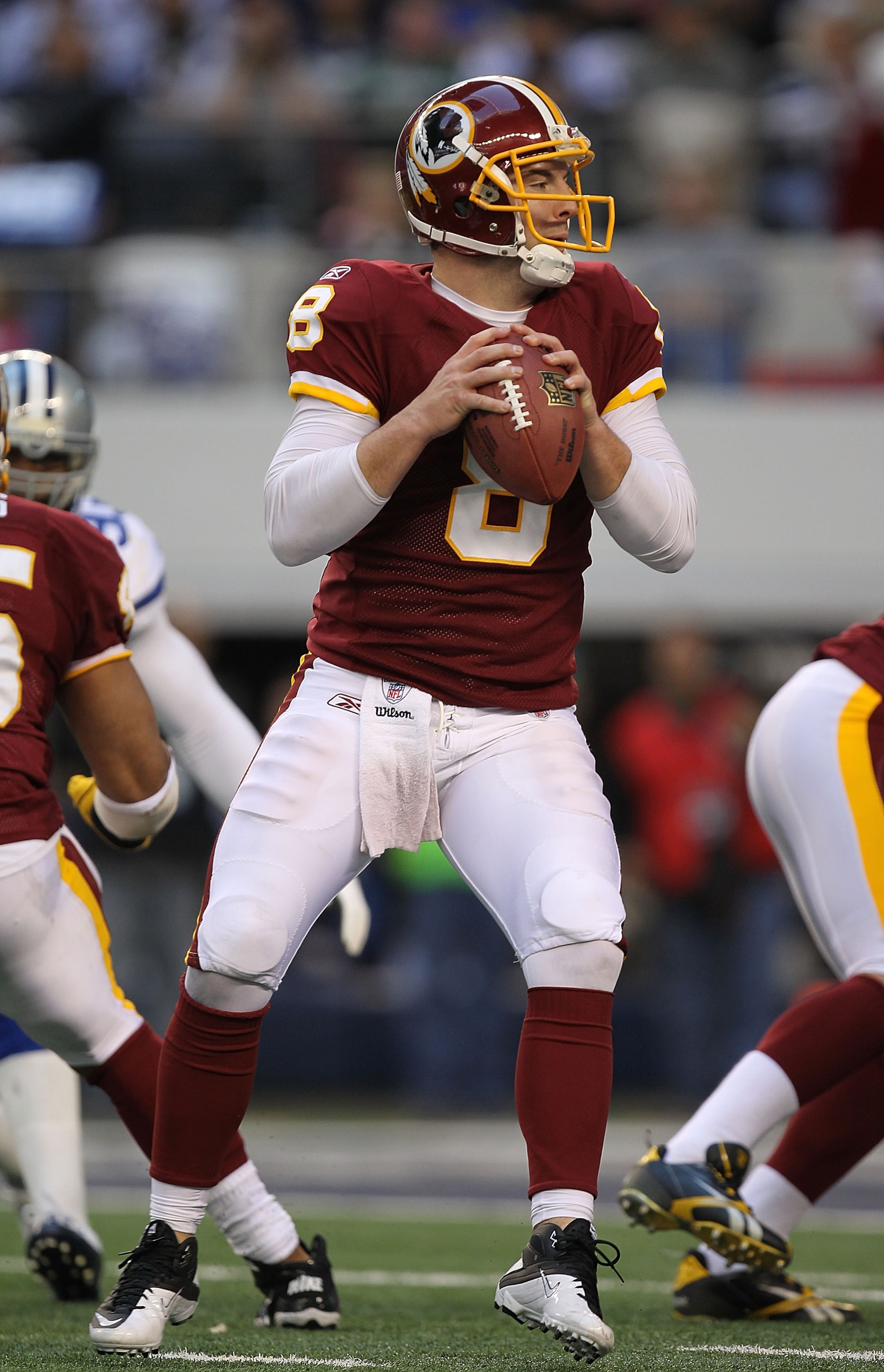 ARLINGTON, TX - DECEMBER 19:  Quarterback Rex Grossman #8 of the Washington Redskins passes against the Dallas Cowboys at Cowboys Stadium on December 19, 2010 in Arlington, Texas.  (Photo by Ronald Martinez/Getty Images)