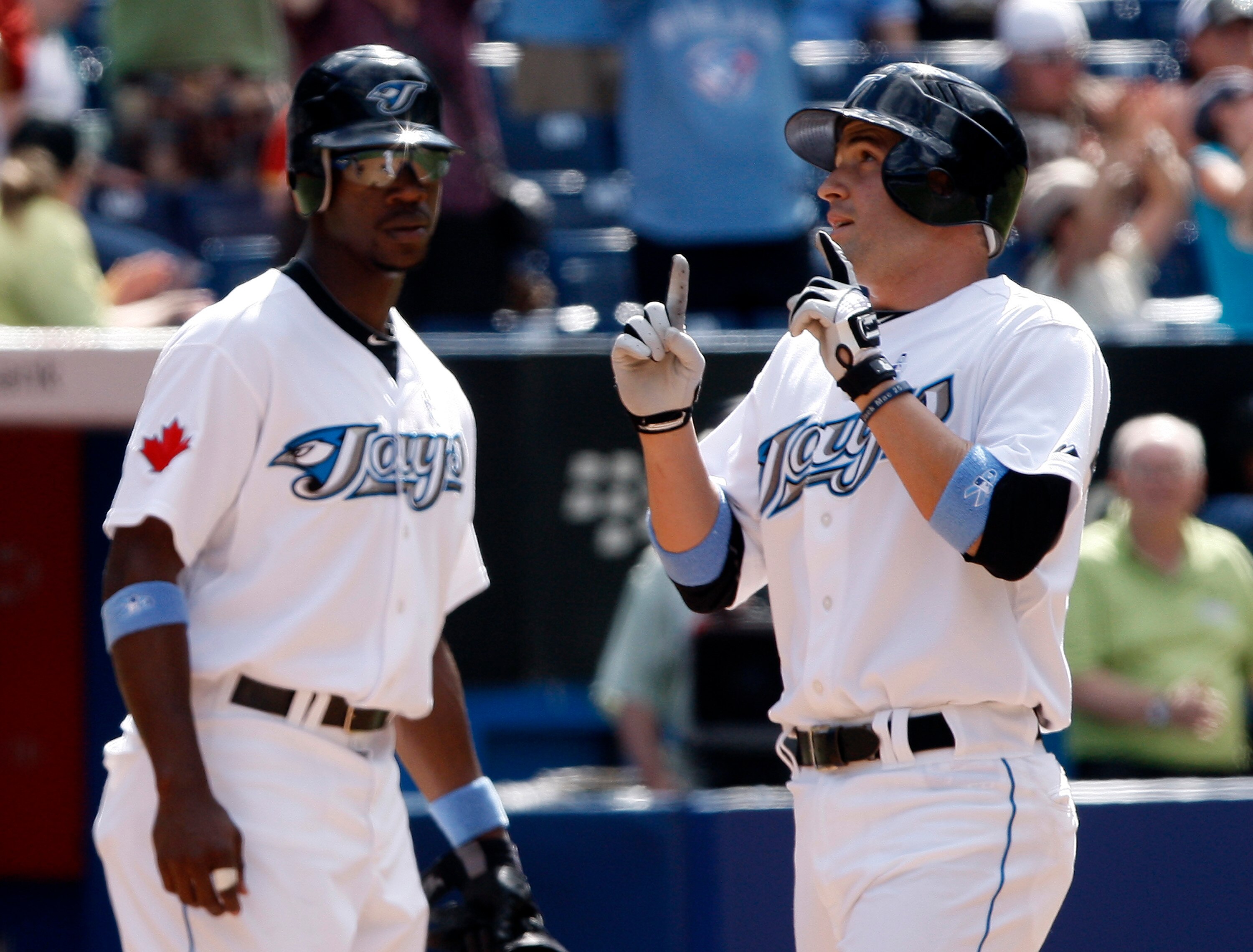 TORONTO - JUNE 20: Fred Lewis #15 and John McDonald #6 of the Toronto Blue Jays celebrate John McDonald home run against the San Francisco Giants at the Rogers Centre during a MLB game June 20, 2010 in Toronto, Ontario, Canada. (Photo by Abelimages/Getty
