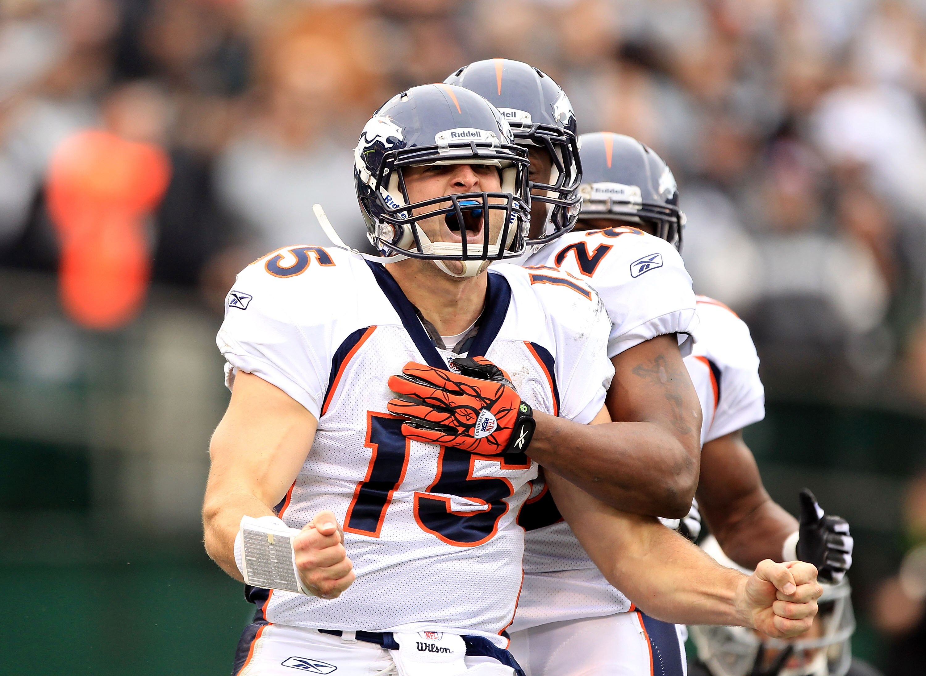 OAKLAND, CA - DECEMBER 19:  Tim Tebow #15 of the Denver Broncos celebrates after he ran in for a touchdown against the Oakland Raiders at Oakland-Alameda County Coliseum on December 19, 2010 in Oakland, California.  (Photo by Ezra Shaw/Getty Images)