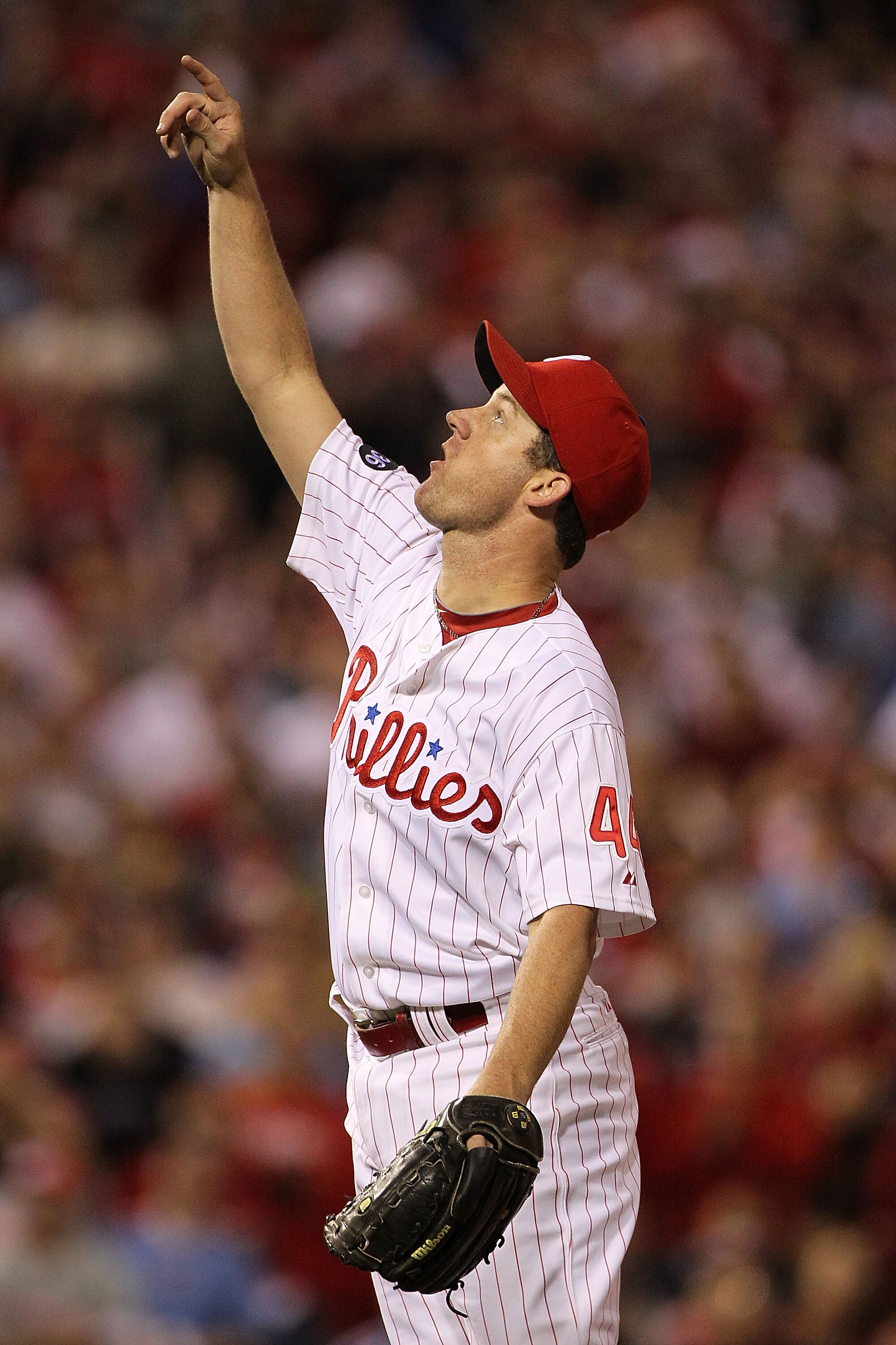 PHILADELPHIA - OCTOBER 17:  Roy Oswalt #44 of the Philadelphia Phillies points up at the ball in the eighth inning against the San Francisco Giants in Game Two of the NLCS during the 2010 MLB Playoffs at Citizens Bank Park on October 17, 2010 in Philadelp
