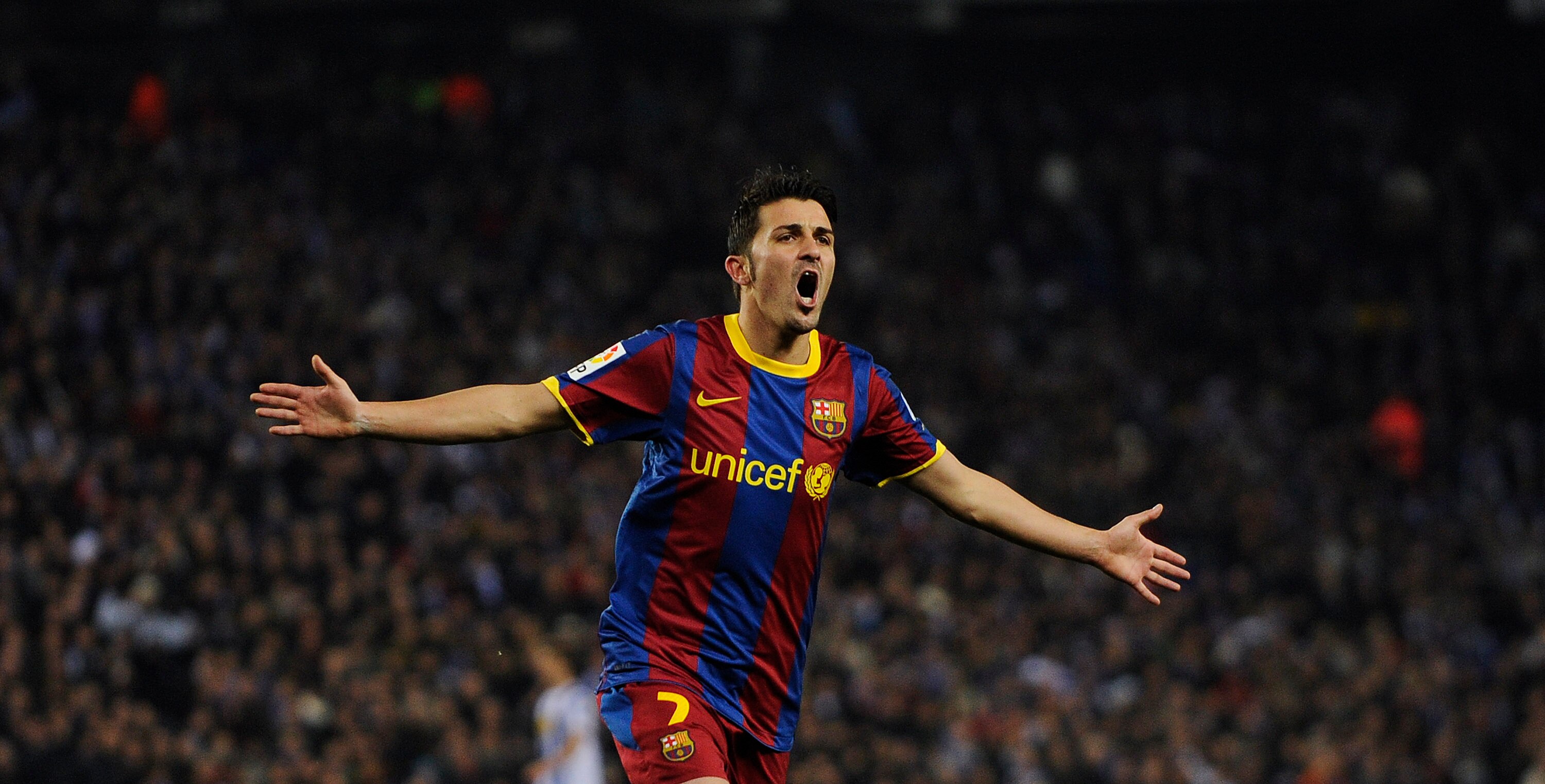 BARCELONA, SPAIN - DECEMBER 18:  David Villa of Barcelona celebrates after scoring his fourth team's goal during the La Liga match between Espanyol and Barcelona at Cornella - El Prat stadium on December 18, 2010 in Barcelona, Spain. Barcelona won 1-5.  (