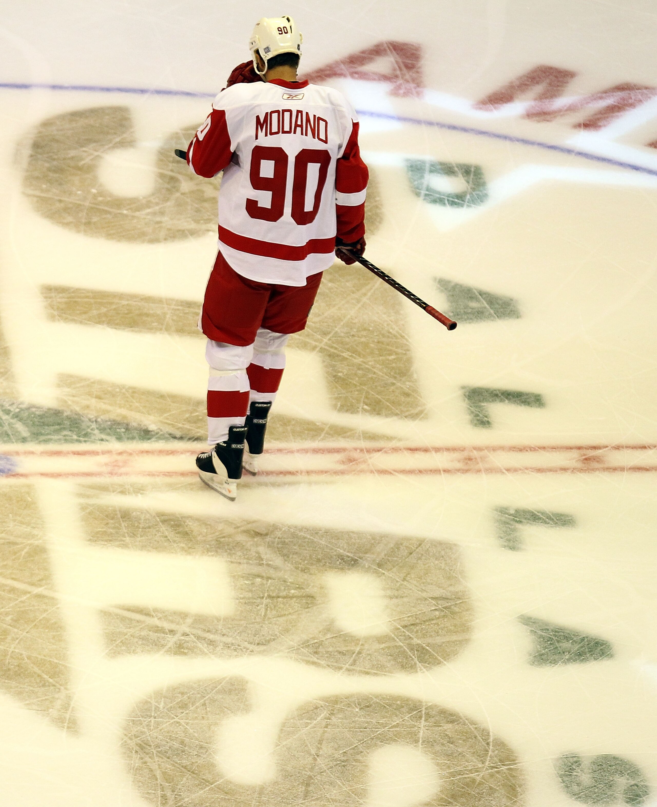 DALLAS - OCTOBER 14:  Center Mike Modano #90 of the Detroit Red Wings skates past center ice during play against the Dallas Stars at American Airlines Center on October 14, 2010 in Dallas, Texas.  (Photo by Ronald Martinez/Getty Images)