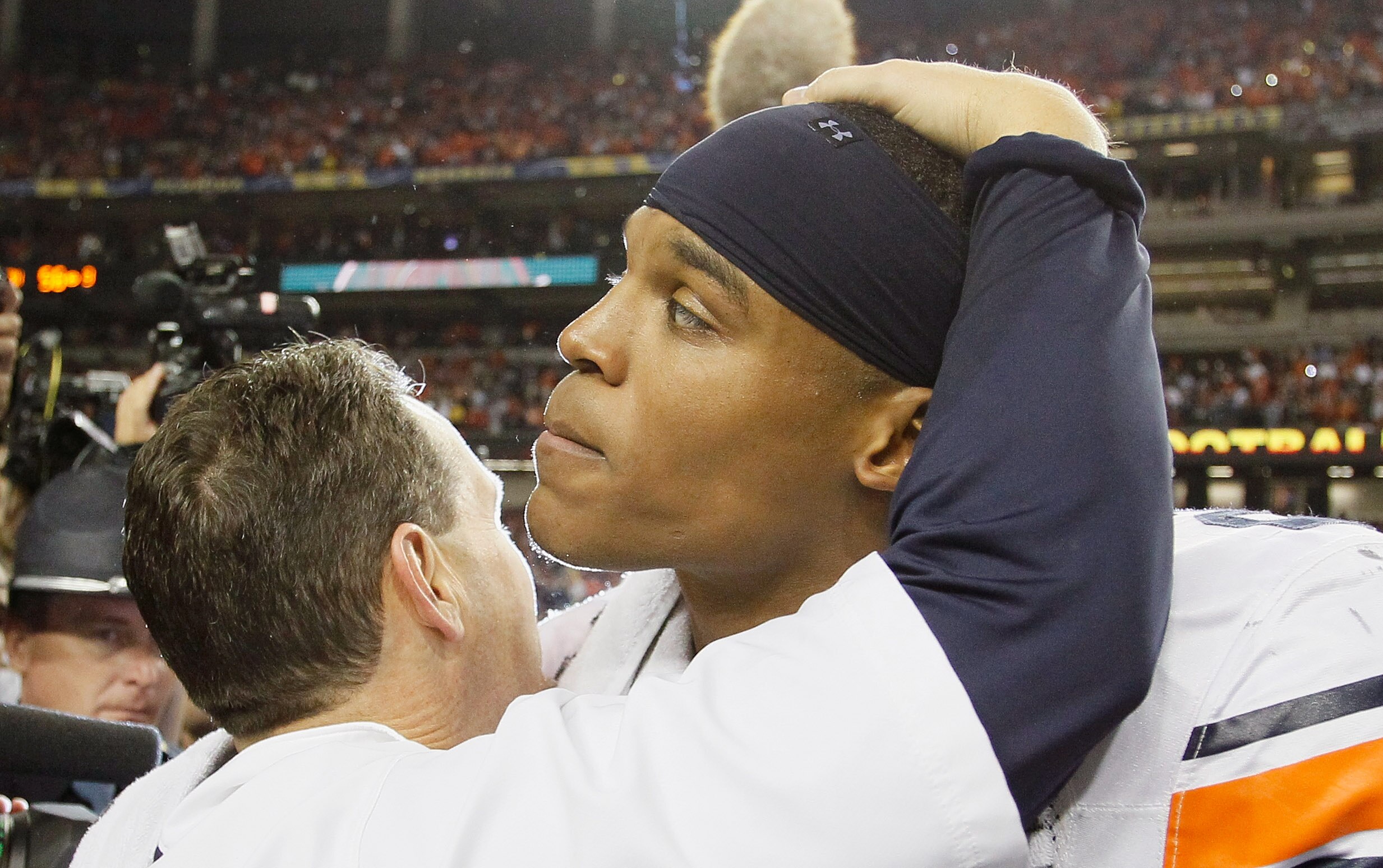 ATLANTA, GA - DECEMBER 04:  Quarterback Cam Newton #2 of the Auburn Tigers celebrates with head coach Gene Chizik after their 56-17 win over the South Carolina Gamecocks during the 2010 SEC Championship at Georgia Dome on December 4, 2010 in Atlanta, Geor