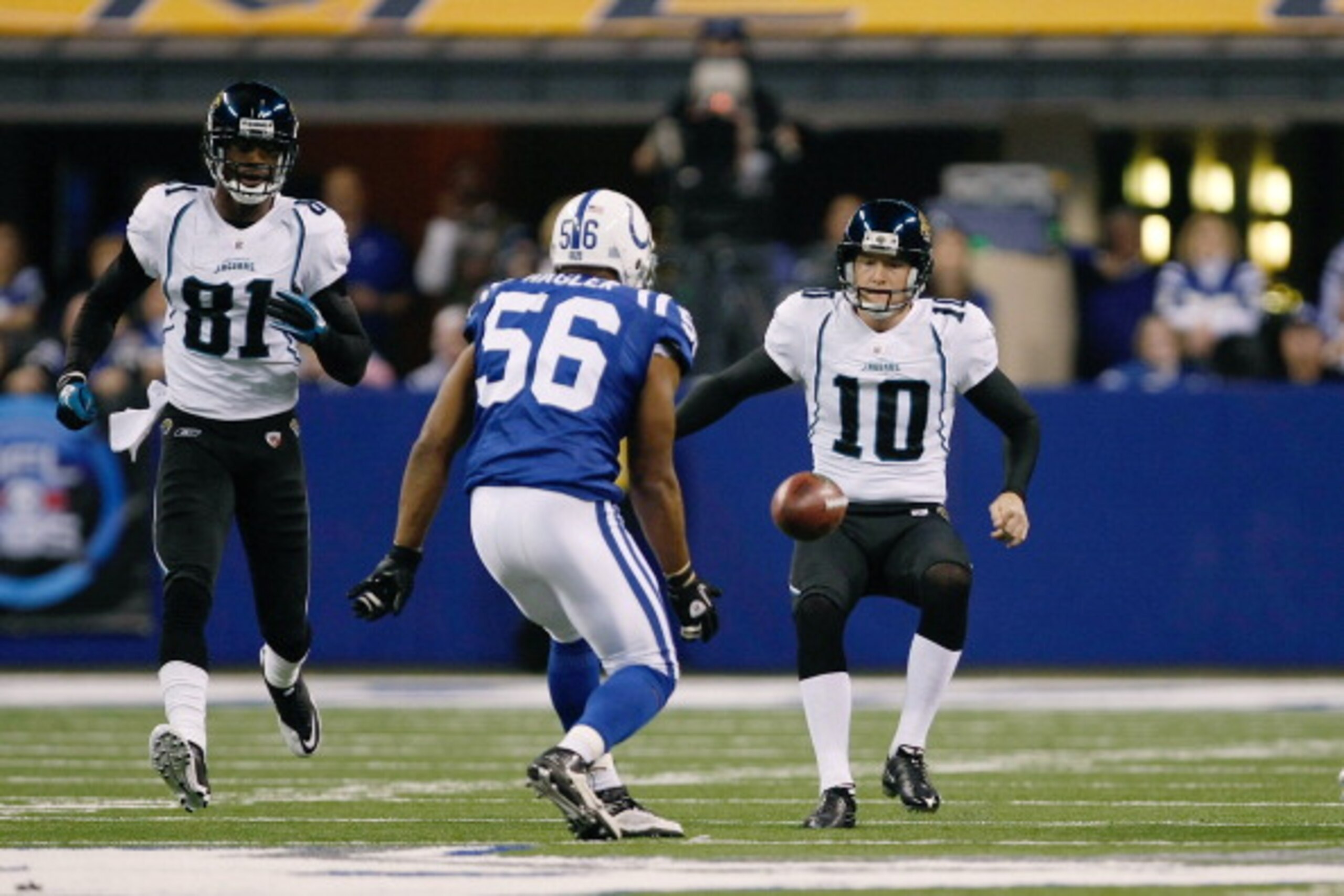 INDIANAPOLIS, IN - DECEMBER 19: Tyjuan Hagler #56 of the Indianapolis Colts runs to recover an onside kick as Josh Scobee #10 and Kassim Osgood #84 of the Jacksonville Jaguars also pursue the football at Lucas Oil Stadium on December 19, 2010 in Indianapo