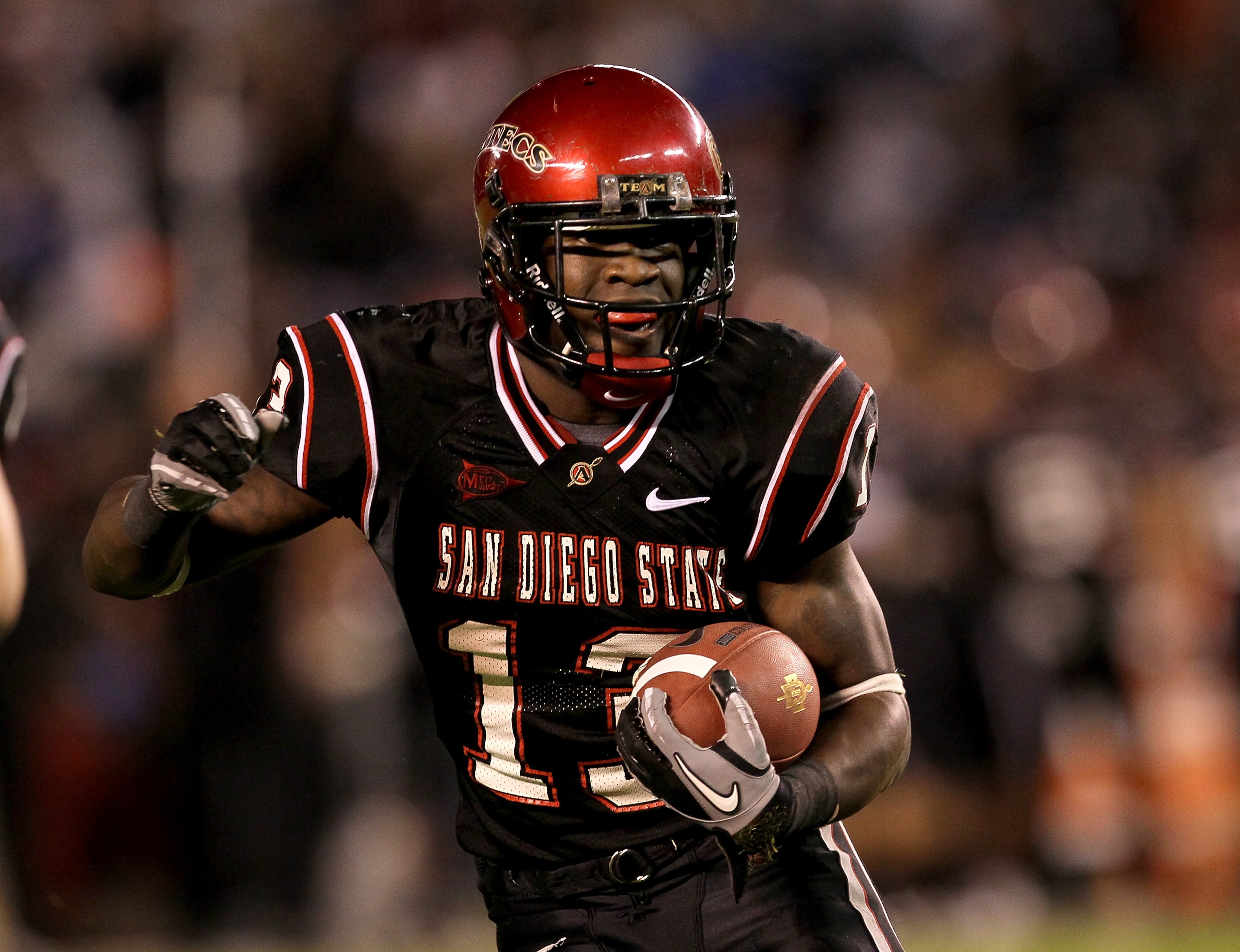SAN DIEGO - NOVEMBER 20:  Running back Ronnie Hillman #13 of the San Deigo State Aztecs carries the ball on a five yard touchdown run in the second quarter against the Utah Utes at Qualcomm Stadium on November 20, 2010 in San Diego, California.  (Photo by