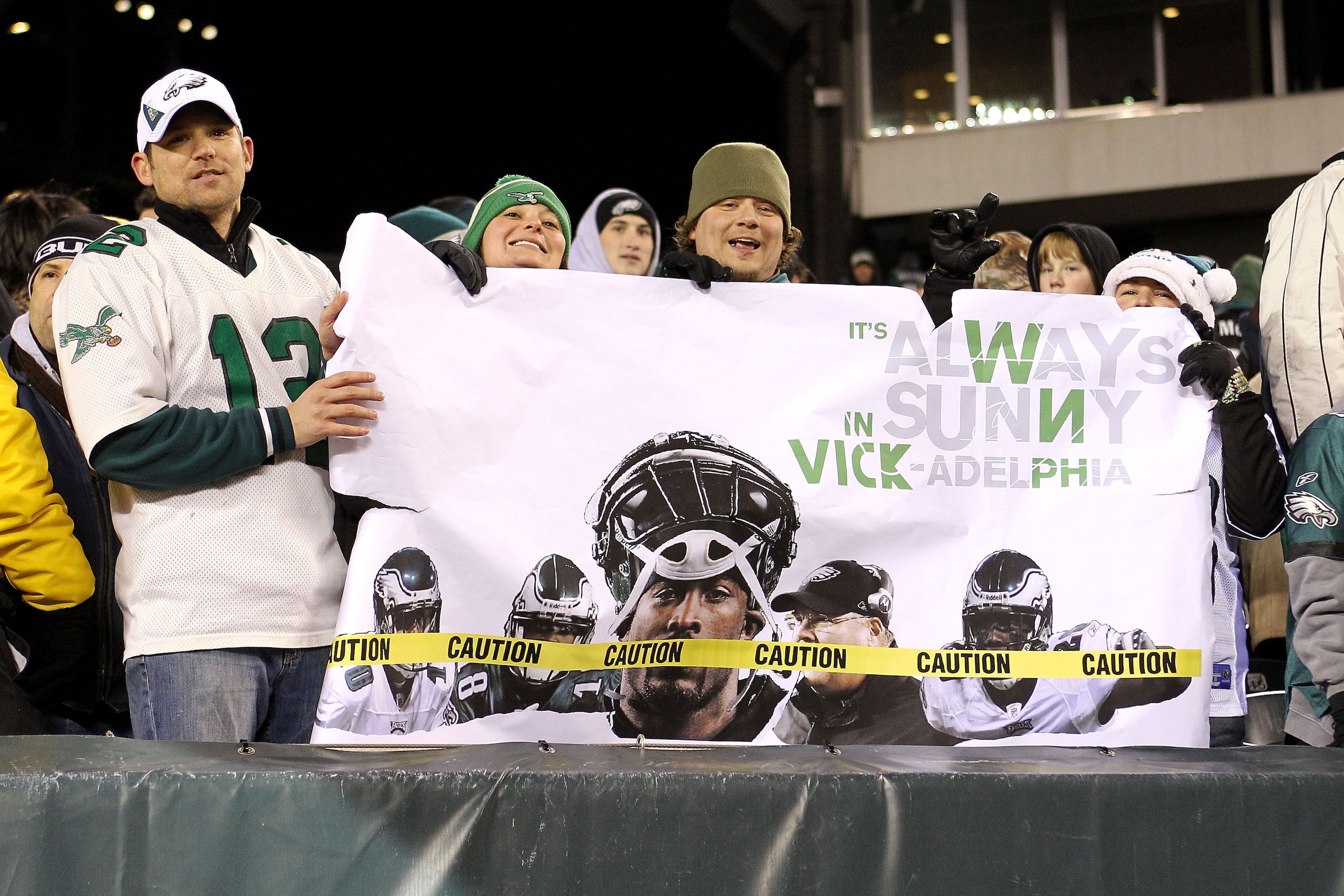 PHILADELPHIA, PA - DECEMBER 02:  Fans of the Philadelphia Eagles hold up a sigh which reads 'It's Always Sunny in Vick -adelphia in reference to quarterback Michael Vick against the Houston Texans at Lincoln Financial Field on December 2, 2010 in Philadel