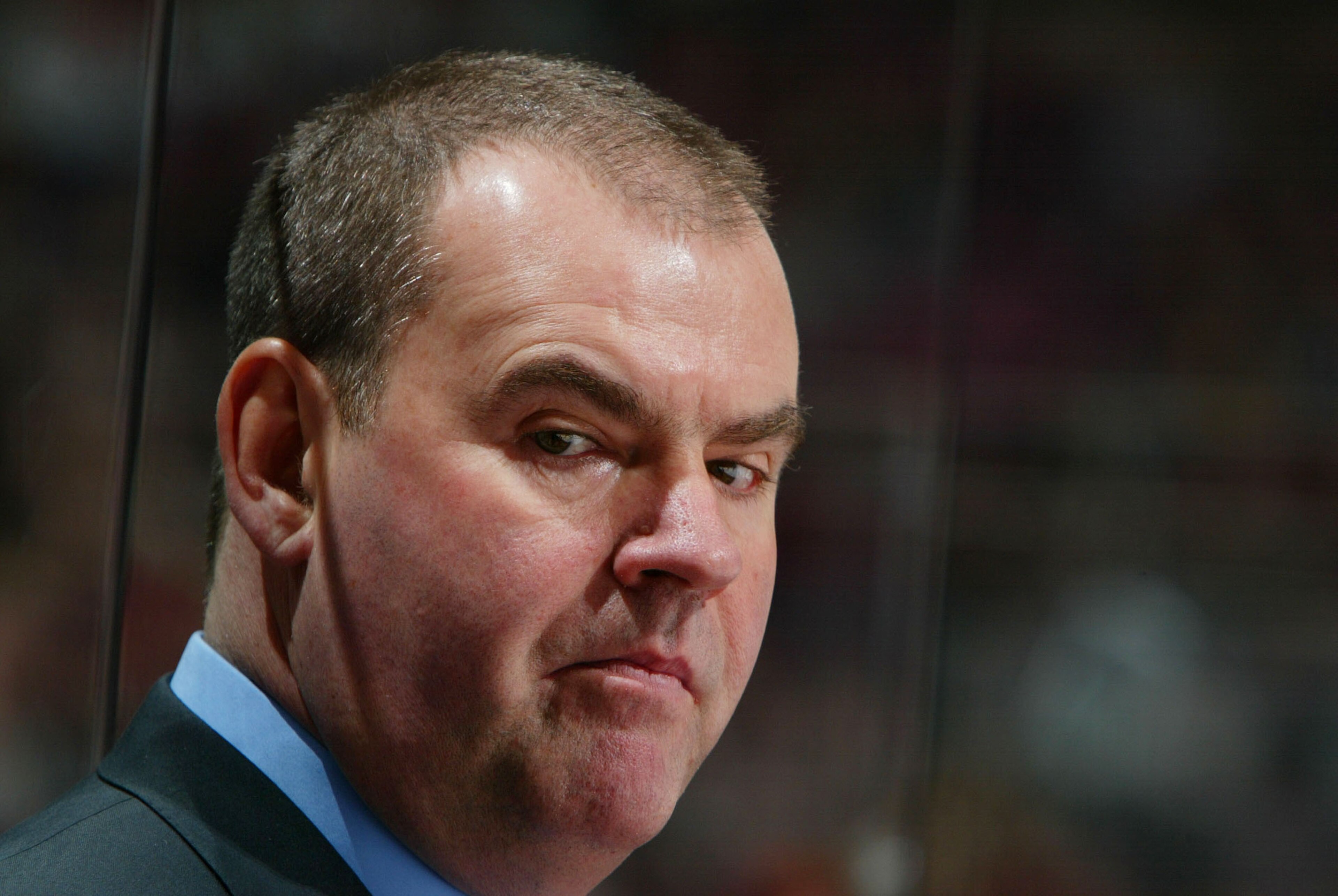 EAST RUTHERFORD, NJ - JANUARY 7:  Pat Burns, head coach of the New Jersey Devils looks on against the Pittsburgh Penguins during their game at the Continental Airlines Arena  on January 7, 2004 in East Rutherford, New Jersey. (Photo by Al Bello/Getty Imag