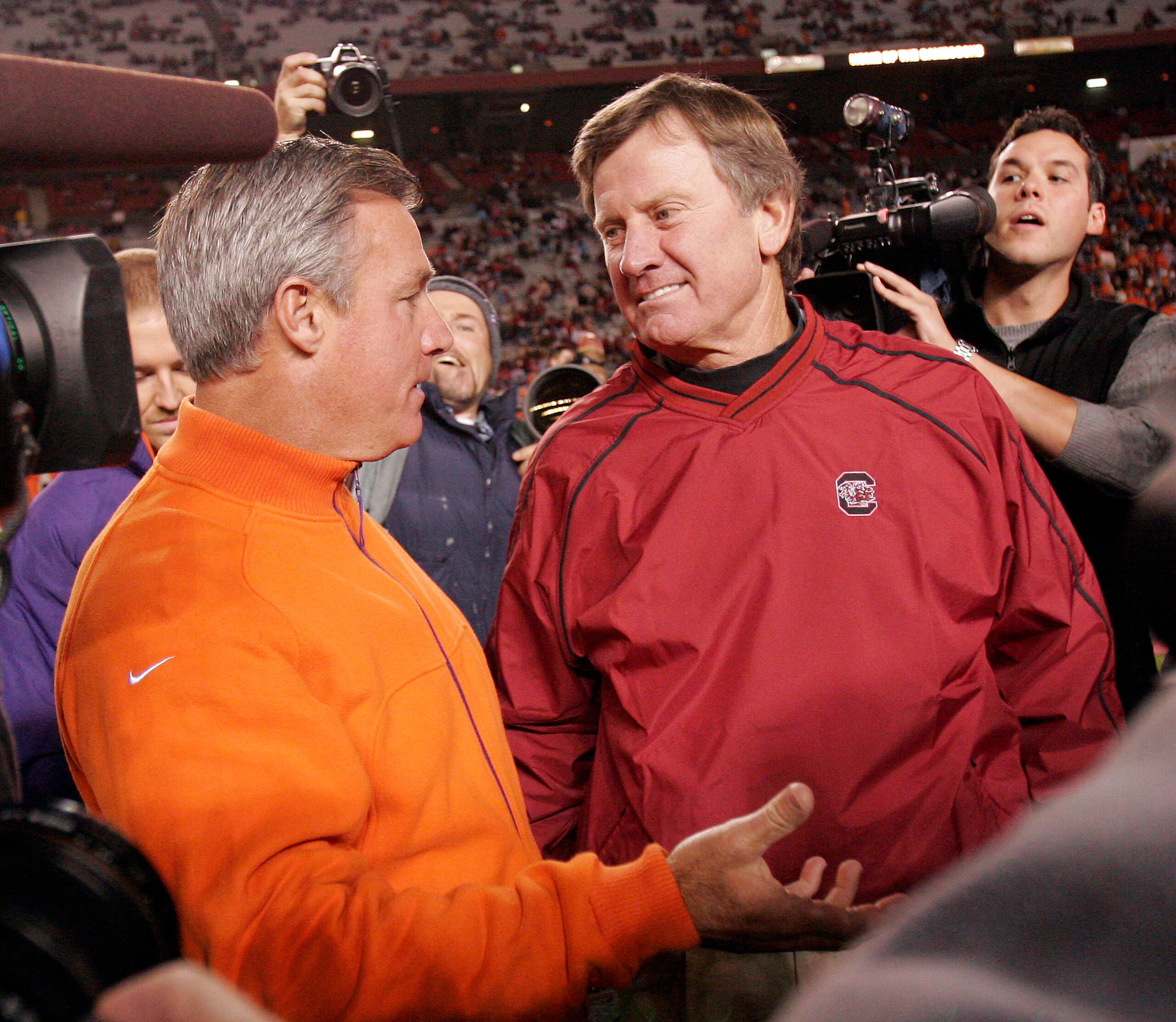 COLUMBIA, SC - NOVEMBER 19: Coach Tommy Bowden of the Clemson Tigers (L) talks with coach Steve Spurrier of the South Carolina Gamecocks on November 19, 2005, at Williams-Brice Stadium in Columbia, South Carolina. Clemson won 13-9.  (Photo By Grant Halver