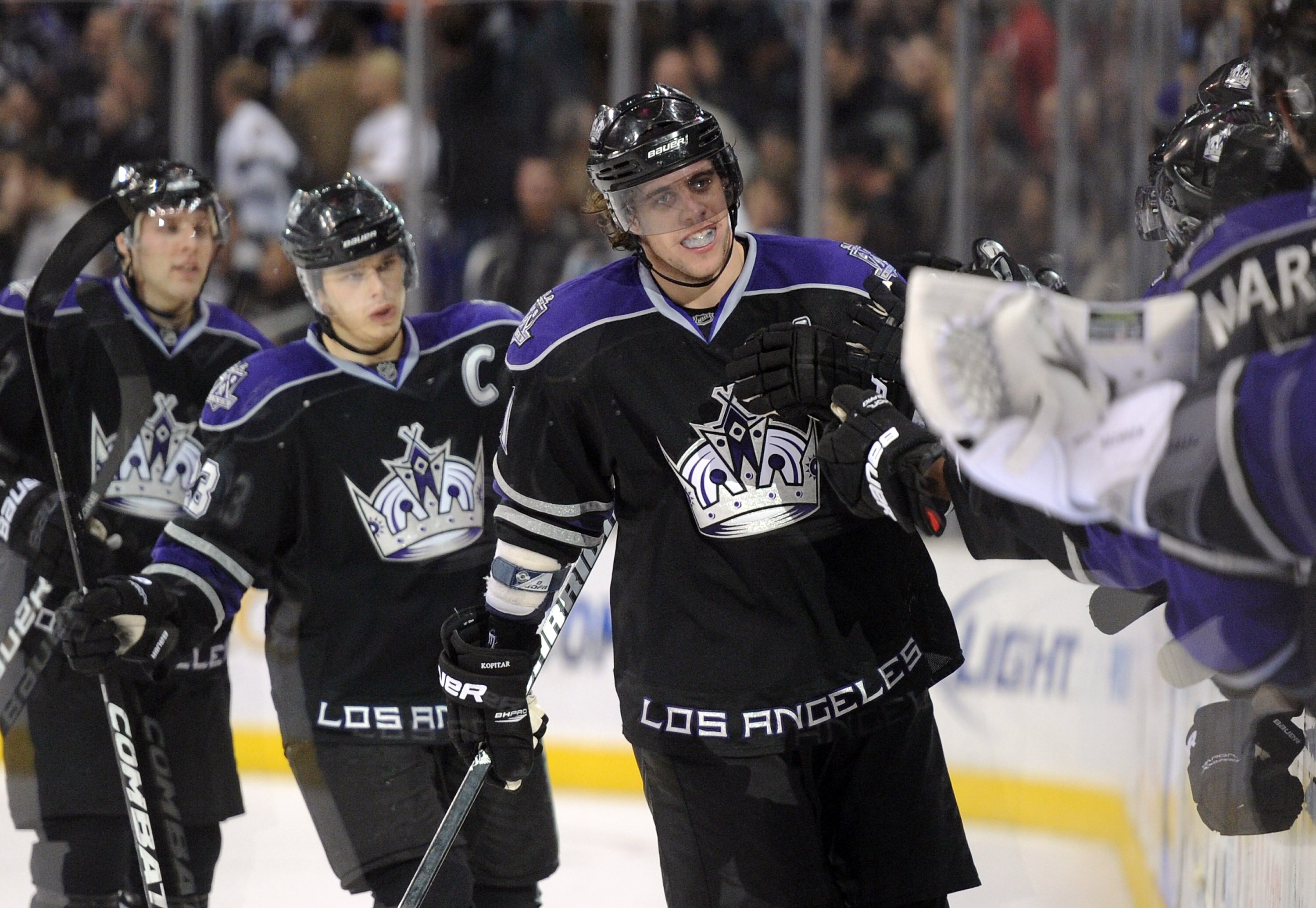 LOS ANGELES, CA - DECEMBER 02:  Anze Kopitar #11 of the Los Angeles Kings celebrates his goal with the bench for a 3-2 win over the Florida Panthers at the Staples Center on December 2, 2010 in Los Angeles, California.  (Photo by Harry How/Getty Images)