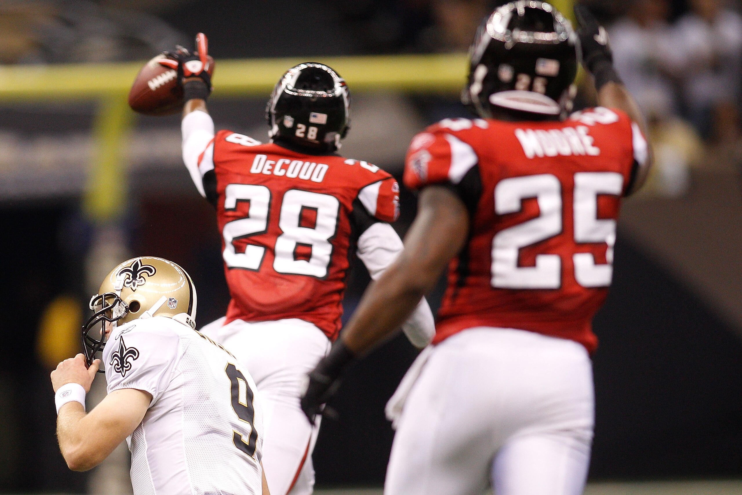 NEW ORLEANS - SEPTEMBER 26:  Thomas DeCoud #28 of the Atlanta Falcons celebrates after making an interception against the New Orleans Saints at the Louisiana Superdome on September 26, 2010 in New Orleans, Louisiana.  (Photo by Chris Graythen/Getty Images