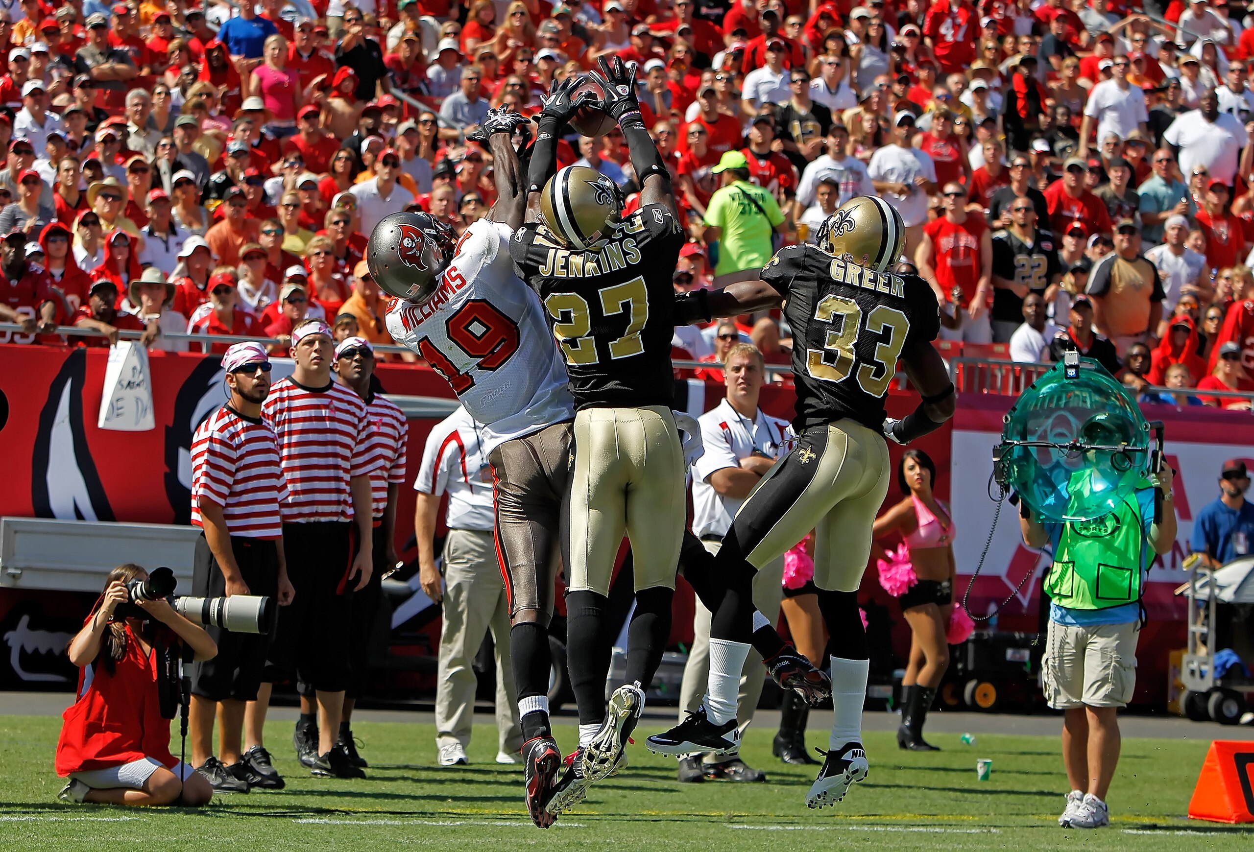 TAMPA, FL - OCTOBER 17:  Defenders Malcolm Jenkins #27 and Jabari Greer #33 of the New Orleans Saints break up a pass intended for Mike Williams #19 of the Tampa Bay Buccaneers during the game at Raymond James Stadium on October 17, 2010 in Tampa, Florida