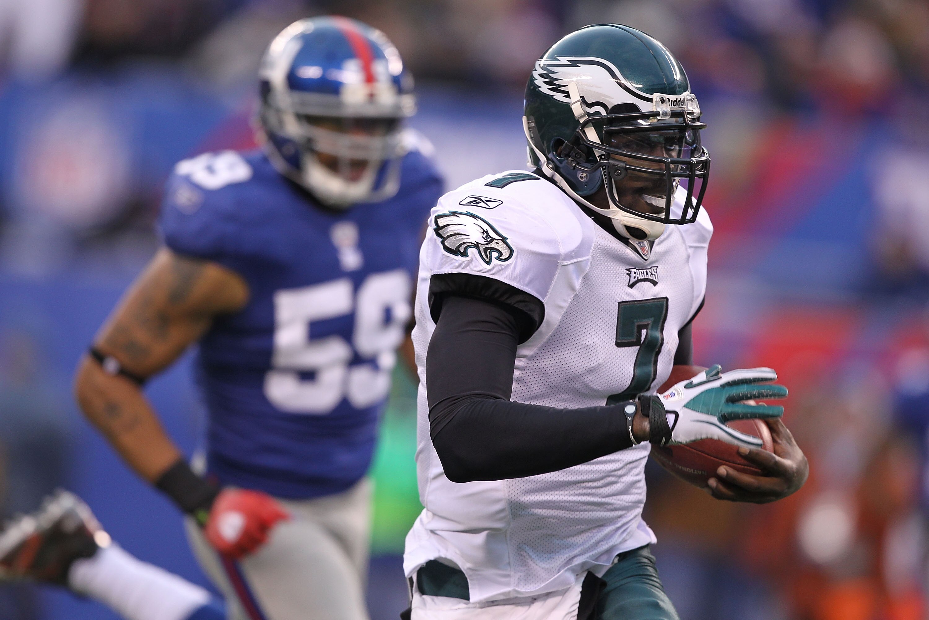 EAST RUTHERFORD, NJ - DECEMBER 19:  Michael Vick #7 of the Philadelphia Eagles scrambles for a big gain against the New York Giants during their game on December 19, 2010 at The New Meadowlands Stadium in East Rutherford, New Jersey.  (Photo by Al Bello/G