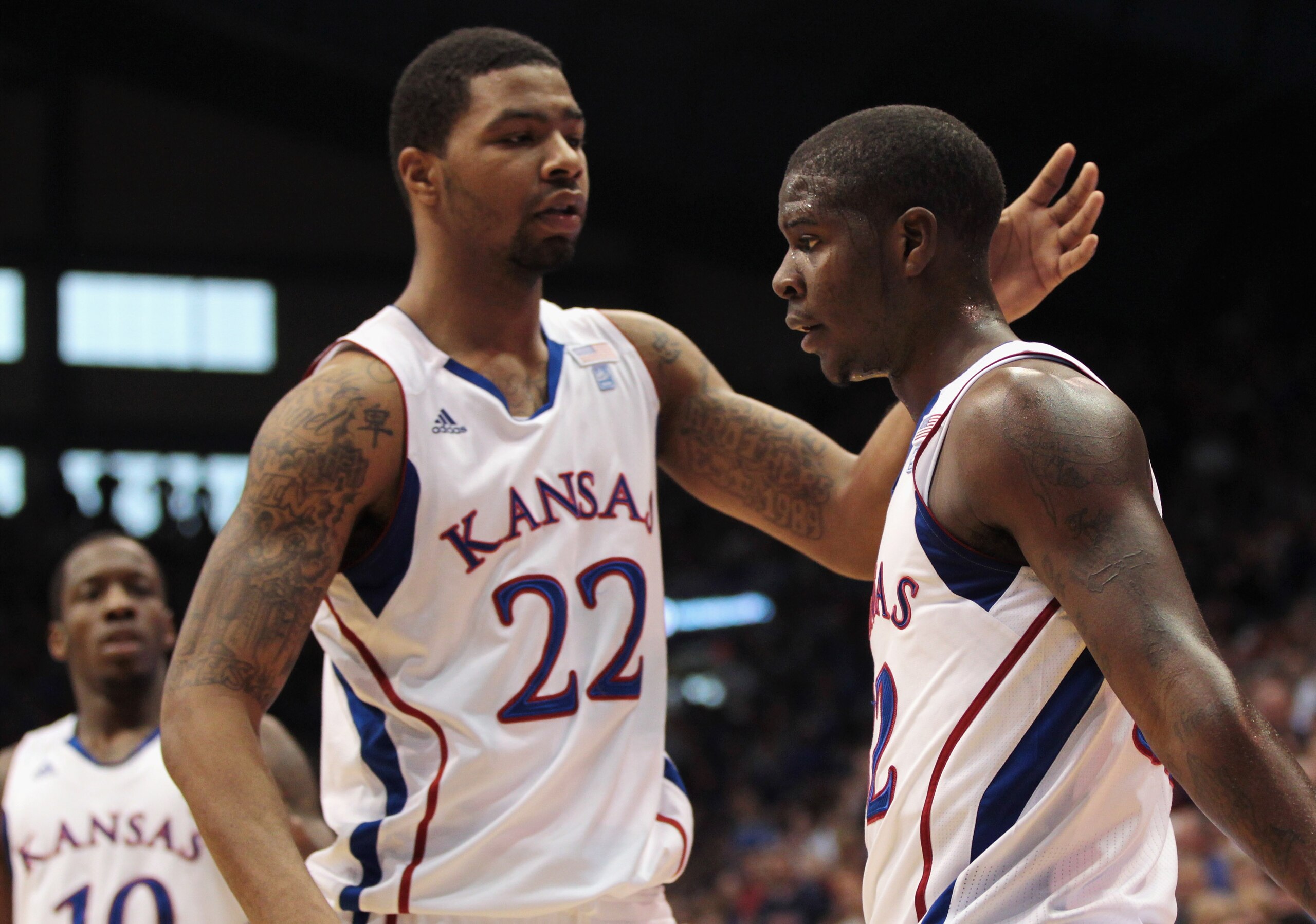 LAWRENCE, KS - DECEMBER 18:  Josh Selby #32 of the Kansas Jayhawks is congratulated by Marcus Morris #22 after drawing a foul during the game against the USC Trojans on December 18, 2010 at Allen Fieldhouse in Lawrence, Kansas.  (Photo by Jamie Squire/Get