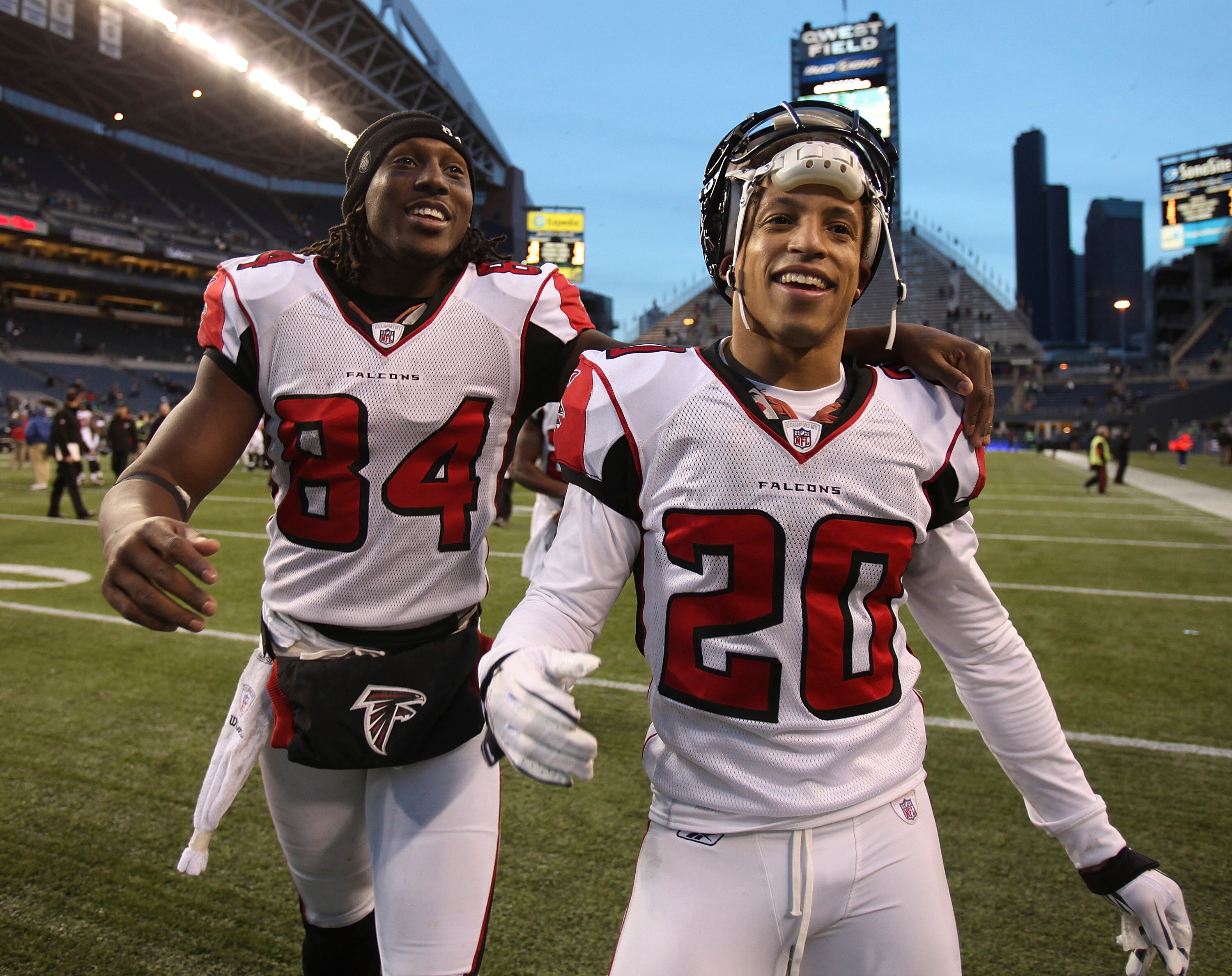 SEATTLE, WA - DECEMBER 19:  Wide receiver Roddy White #84 and Brent Grimes #20 of the Atlanta Falcons celebrate as they leave the field after defeating the Seattle Seahawks 34-18 at Qwest Field on December 19, 2010 in Seattle, Washington. (Photo by Otto G