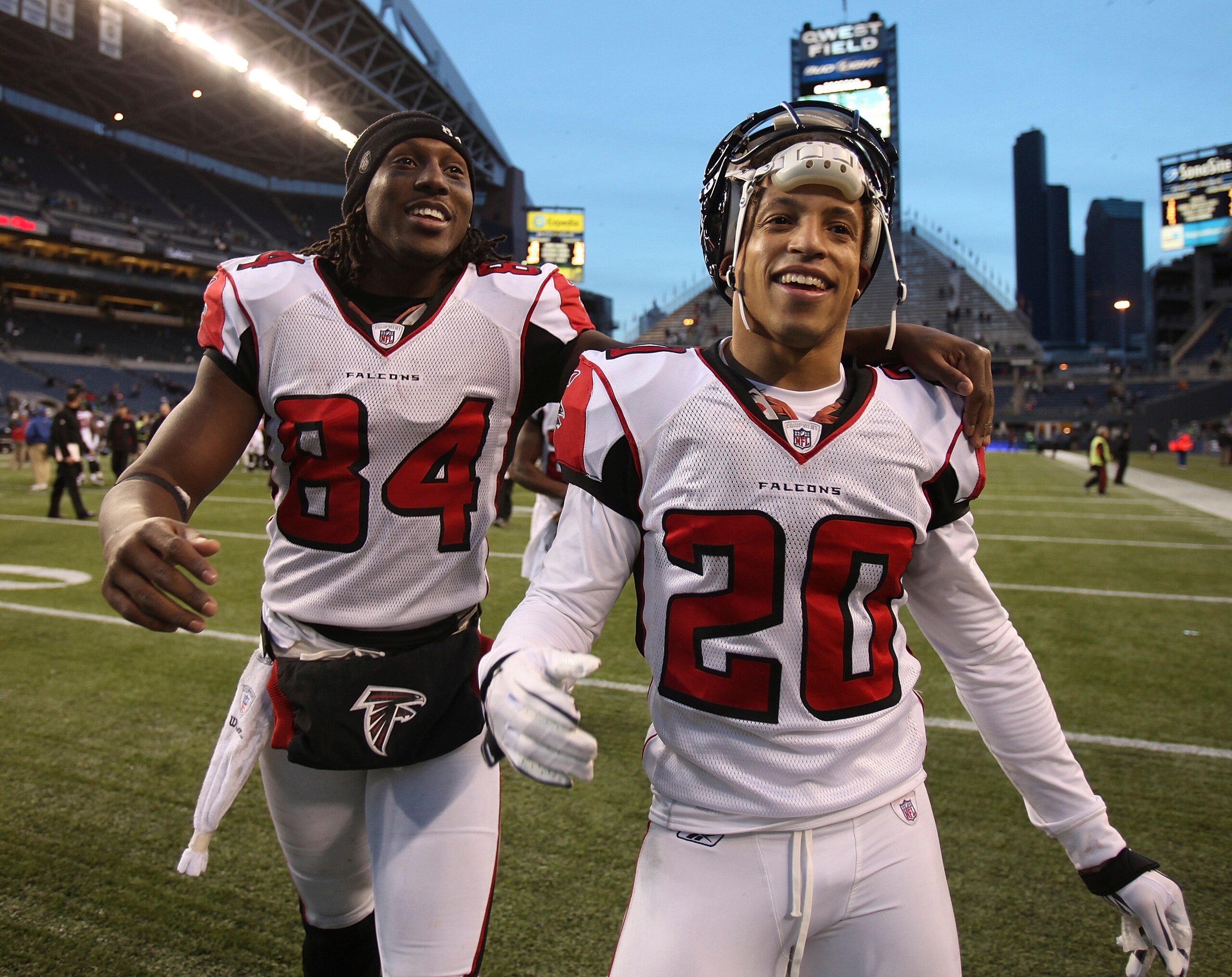 SEATTLE, WA - DECEMBER 19:  Wide receiver Roddy White #84 and Brent Grimes #20 of the Atlanta Falcons celebrate as they leave the field after defeating the Seattle Seahawks 34-18 at Qwest Field on December 19, 2010 in Seattle, Washington. (Photo by Otto G