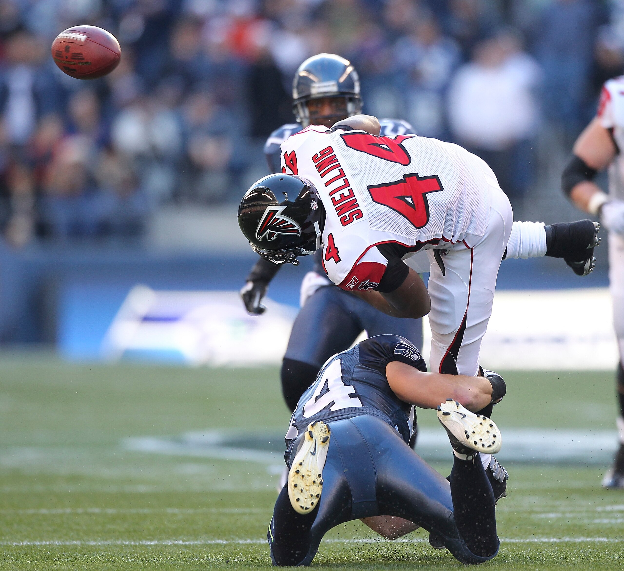 SEATTLE, WA - DECEMBER 19:  Running back Jason Snelling #44 of the Atlanta Falcons fumbles as he is tackled by Will Herring #54 of the Seattle Seahawks at Qwest Field on December 19, 2010 in Seattle, Washington. The Falcons defeated the Seahawks 34-18. (P