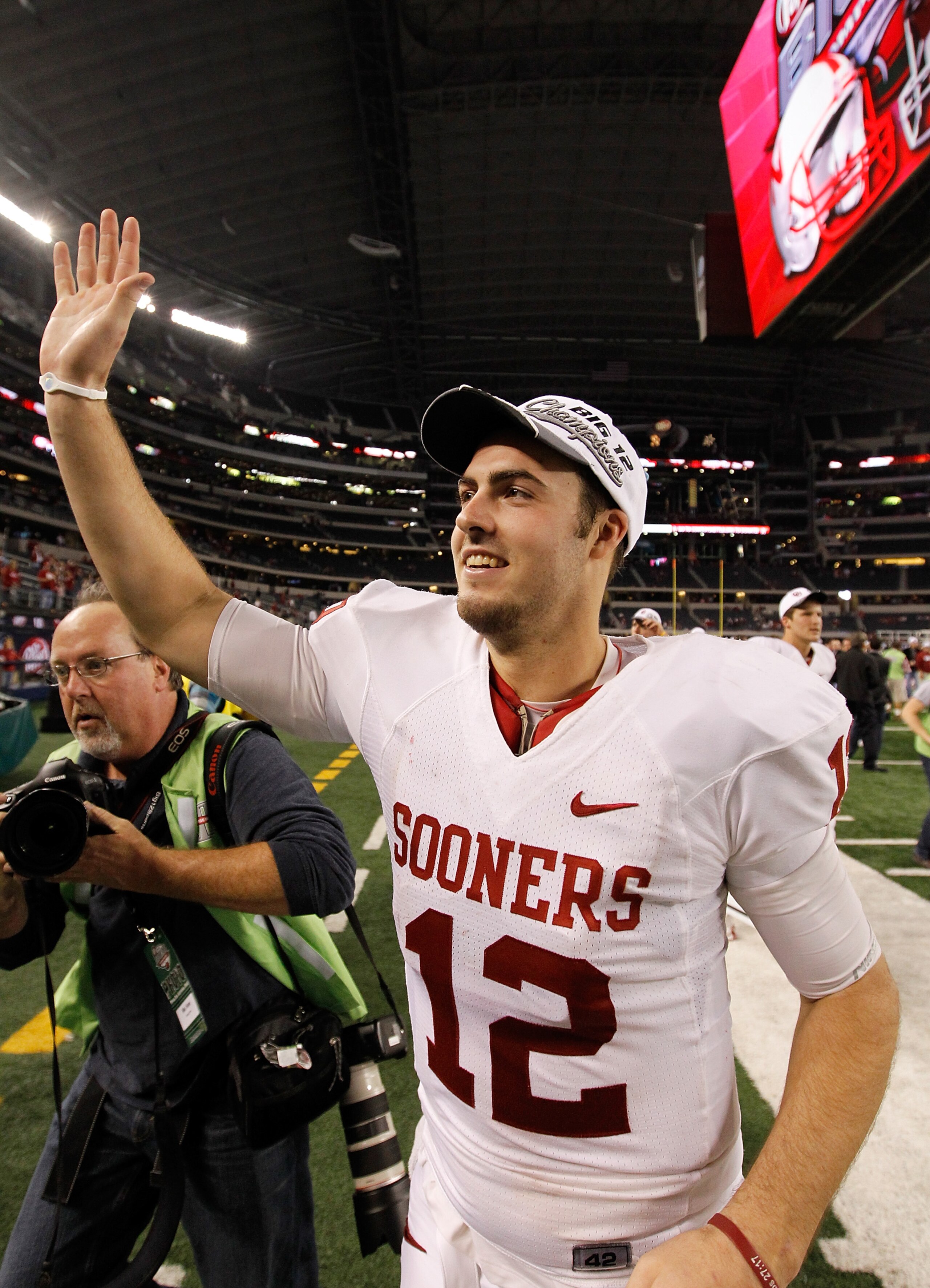 ARLINGTON, TX - DECEMBER 04:  Quarterback Landry Jones #12 of the Oklahoma Sooners celebrates after the Sooners beat the Nebraska Cornhuskers 23-20 at Cowboys Stadium on December 4, 2010 in Arlington, Texas.  (Photo by Tom Pennington/Getty Images)