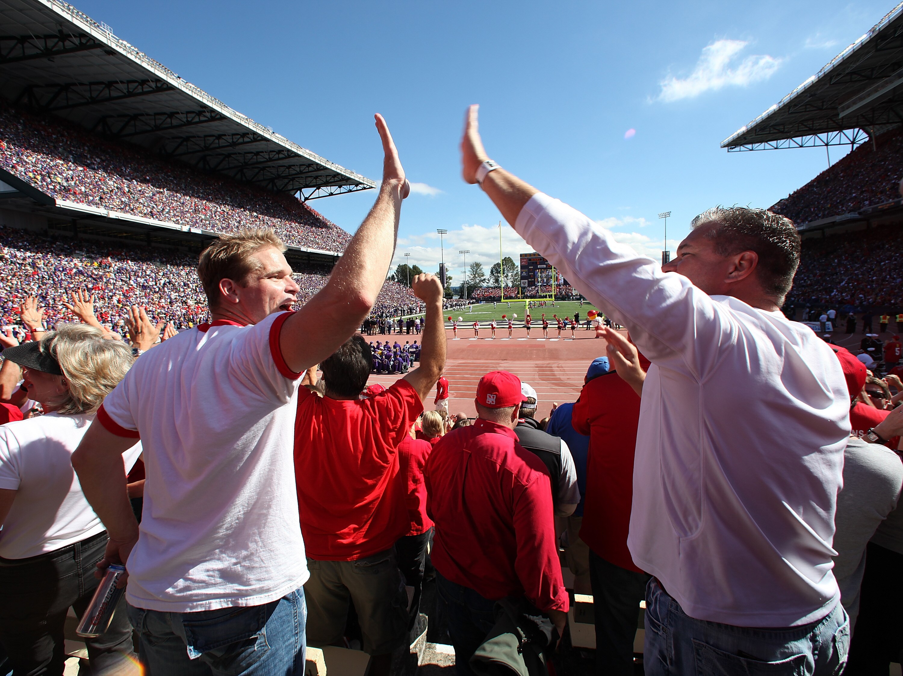 SEATTLE - SEPTEMBER 18:  Fans of the Nebraska Cornhuskers cheer after the Cornhuskers scored their first touchdown against the Washington Huskies on September 18, 2010 at Husky Stadium in Seattle, Washington. The Cornhuskers defeated the Huskies 56-21. (P